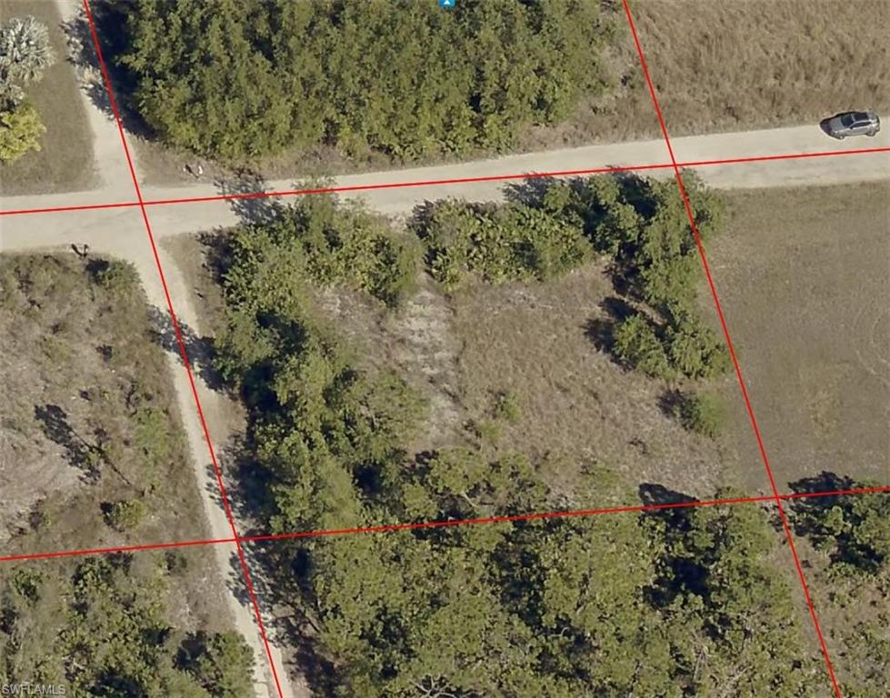 Oversized .46-Acre Lot in Flood Zone X – Build Your Pine Island Dream!
Tucked away in the peaceful acreage area of Bokeelia, this spacious 20,120± sq. ft. corner lot offers the perfect opportunity to create your own slice of island paradise. With access from two sides, this corner parcel provides added flexibility for future home placement, driveway design, and overall use of the property.

Located in desirable Flood Zone X, the property is considered to have a lower risk of flooding, offering added peace of mind for future development.

Enjoy the quiet, Old Florida charm that makes Pine Island so special while still being just minutes from world-class fishing, boating, waterfront restaurants, marinas, and stunning sunsets over Charlotte Harbor. With ample space for a custom home, garage, workshop, boat storage, or additional outdoor living, the possibilities are wide open.

Electric service is available in the area. Utilities are not currently installed on the property, giving the new owner full flexibility in designing their future build. Buyer to verify utility availability and connection requirements.

Whether you're looking to build now or invest for the future, this oversized corner homesite offers space, privacy, and the laid-back island lifestyle that buyers come to Pine Island to find.

Bring your plans, your boat, and your vision—your island dream starts here.
