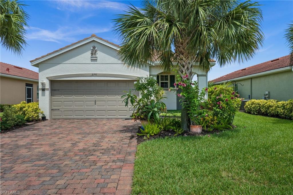 Enjoy relaxed Florida living in this beautifully maintained 3-bedroom, 2-bath home located in the desirable Cascades at River Hall - one of Southwest Florida's premier 55+ communities! This inviting residence features a tranquil lake view and an east-facing lanai, allowing you to enjoy peaceful mornings with the warmth of the sunrise and cooler afternoons outdoors. Inside, you'll find an open-concept floor plan and the kitchen at the heart of the home that features granite countertops, stainless-steel appliances, and a spacious island that's perfect for meal prep and entertaining. The primary bedroom offers a beautiful accent wall, pendant lighting and an en-suite bathroom with dual sinks, shower, and a walk-in closet with built-ins. Additional features include a front patio, attached 2-car garage offering convenience and extra storage space, French doors, and a tile roof. Residents of Cascades at River Hall enjoy access to outstanding resort-style amenities, including a community pool, fitness center, clubhouse, tennis and pickleball courts, and a full calendar of social activities. For golf enthusiasts, membership opportunities are available at River Hall's golf course, providing an exceptional lifestyle both on and off the course. Experience the perfect combination of comfort, community, and scenic beauty in one of Southwest Florida's most sought-after active adult neighborhoods.