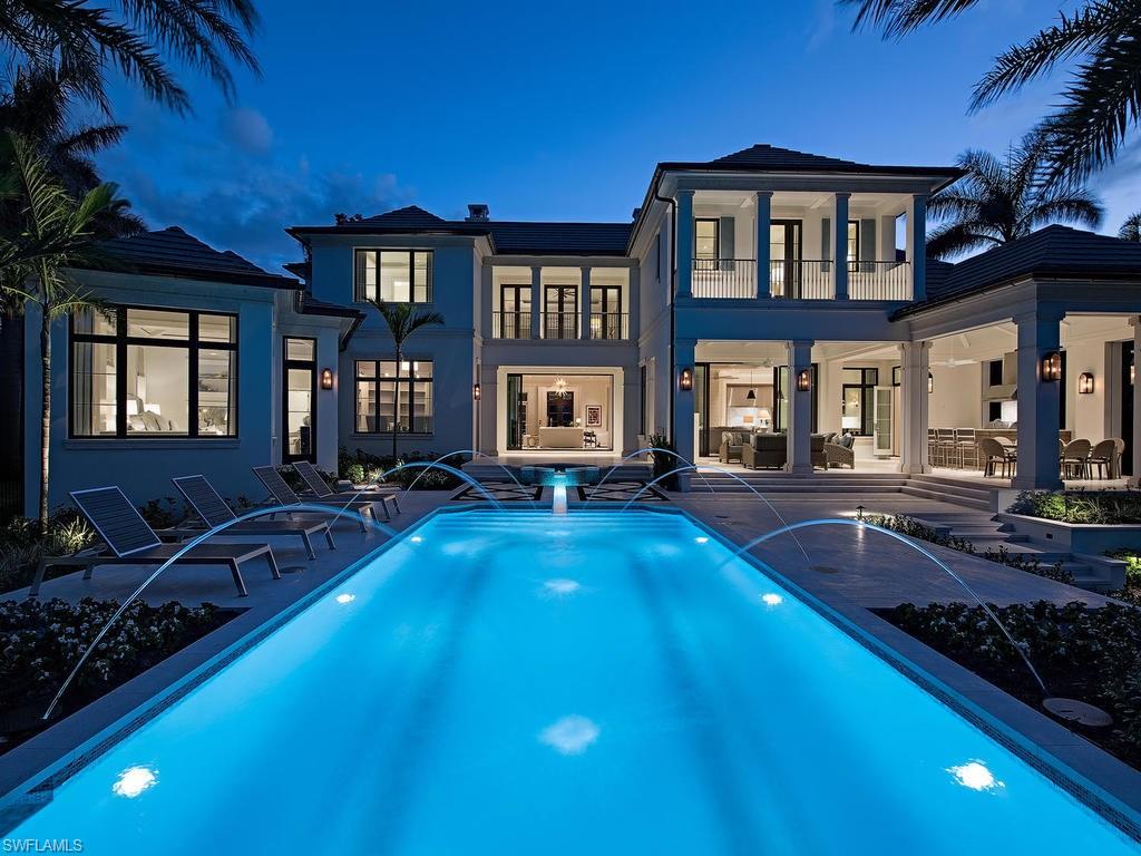 Exceptional design & impeccable quality define this new construction, custom-built estate located on a private oversized lot overlooking the wide waters of Old Harbour Cove. Beautifully finished with a calm neutral pallet, the home offers a gracious living room, wet bar, spacious family room, gorgeous well-appointed kitchen, walk-in pantry, butler's pantry, elegant dining room with an impressive wall of wine, waterfront study, 2nd office/craft room and 3 laundry rooms. A private owner's suite is its own retreat offering a seating area, morning bar, separate baths and an outdoor garden and shower. Five well-appointed guest-suites include a separate guest apartment. with a full kitchen. 10' pocketing glass doors seamlessly transition the indoor spaces into the large outdoor living with a stone fireplace, summer kitchen, roll down screens & hurricane shutters and a sun-filled pool deck, spa, and sensational pool. A boat dock sits on the water's edge with easy access to the Gulf of Mexico. Complete with 5-car garage and a 45 kw generator. Conveniently located to the Port Royal beach club, fitness & tennis, this opportunity offers the best Port Royal has to offer. Beautifully furnished.