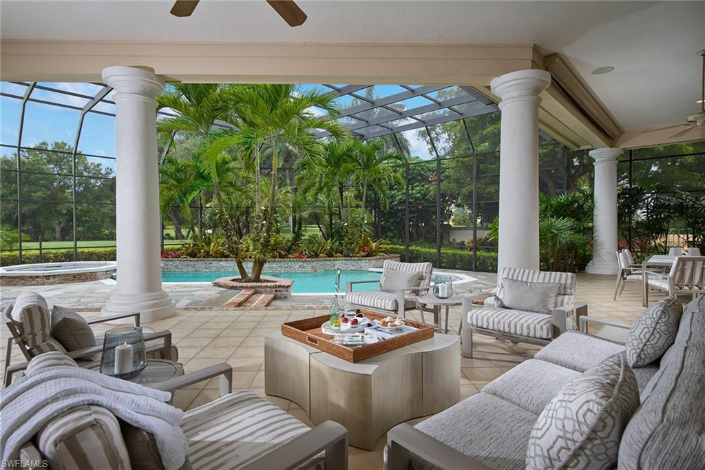 This stately Georgetown home is beautifully situated on an oversized lot to capture golf course views and sunset skies. The floor plan is open with generous room proportions, crown moldings, marble and wood flooring, and a wet bar. Entertaining areas include a sun-filled living room and family room with fireplace that opens to an expansive screened lanai, with heated pool, spa and pool bath. A true chef’s kitchen features double ovens, gas cooktop, center island, large pantry and breakfast nook. The spacious, private master suite opens to the outdoors through French doors and boasts a timeless marble bath with dual walk-in closets. This home features a grand entry, fabulous private office, en-suite bedrooms, a large laundry room with additional storage and a three-car garage. Georgetown is a gated enclave of homes within Pelican Bay with lovely plantings. Enjoy all the amenities of Pelican Bay exclusive beach clubs, private beachfront dining, fitness and wellness center and 18 Har-Tru tennis courts, the opportunity to join Club Pelican Bay with 27 holes of championship golf and a brand new, state-of-the-art clubhouse.
