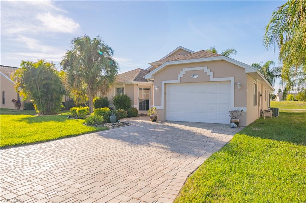 WELCOME to your SW Florida retreat! This well-maintained 3 Bed/ 2 Bath home, with an open and bright layout, overlooks the 12th green of the Sabal Springs golf course. The 1 1/2 car garage will fit your car and golf cart. Complementing the exterior is a wide paver driveway and front walk, screened front porch entry and cement curbing around the landscaping. The exterior maintenance and irrigation is handled by the HOA, including exterior house painting every 7 years. This active 55+ community has must-see resort style amenities around the centrally located Clubhouse, including: Jr Olympic sized pool, Tennis courts, Pickleball, Billiards room, Exercise rooms, Saunas, Pro Shop, Golf cart rentals, Library, Restaurant and Bar, Private Dining room/Ballroom. Membership to the 18 hole Executive Golf course is optional. The home is equipped with roll-down hurricane shutters throughout and electric shutters cover the screened lanai area. Updates include: New roof in 2015, New hickory style plank flooring in living room and master, New slate colored LG appliances in kitchen. Furniture is negotiable. With this home you are Move-in ready - pack your bags!
