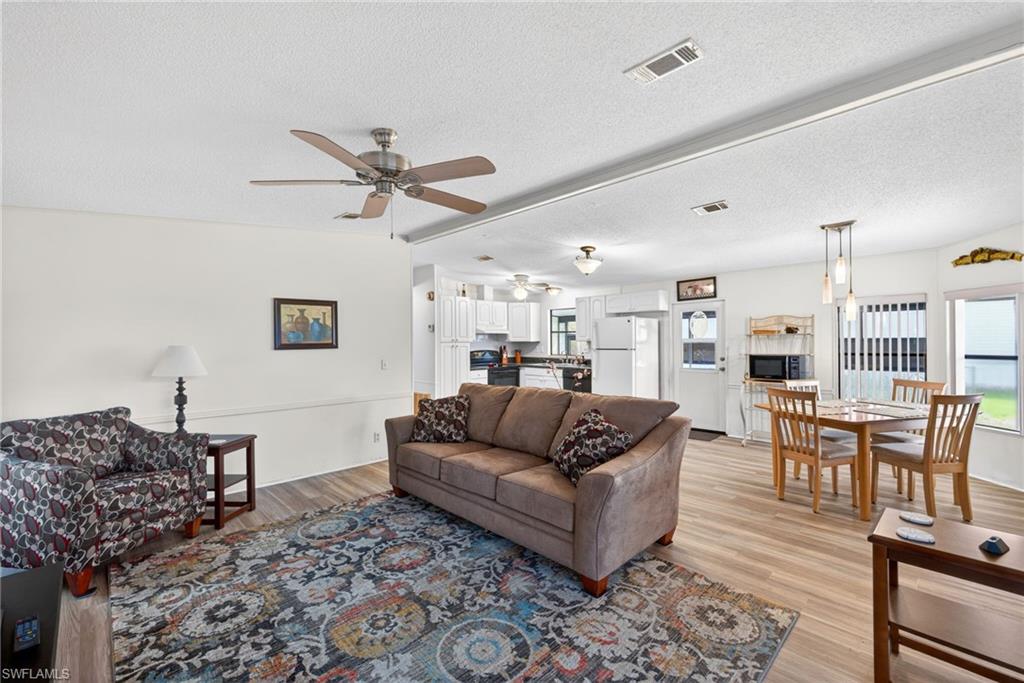 Whether you’re looking for a full-time residence or a seasonal getaway, this open-floor plan manufactured home offers the perfect combination of space and conveinence. From the moment you step inside, you’ll notice the brand-new flooring that spans the entire layout, providing a fresh, cohesive look that is as durable as it is attractive. This home does need a little TLC to make it a comfortable and secure living space, thus it has been competitively priced to offer value.
Beyond the aesthetic updates, this property has been enhanced with significant mechanical and structural improvements designed for long-term comfort. The HVAC system (2018) ensures reliable climate control, while brand-new blown insulation has been added underneath the home to maximize energy efficiency and keep utility costs low. The exterior is equally impressive, featuring a durable rubber roof known for its excellent weather resistance and longevity.
This home comes equipped with hurricane straps for added structural integrity. With the interior refreshed, this turn-key property is ready for you to add your own enhancements and complete the renovations to make it move a worry-free 55+ lifestyle. Don't miss your chance to own a move-in-ready home that truly checks all the boxes.
