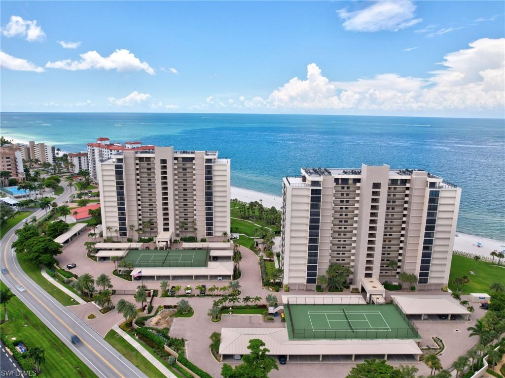 Wonderful Three Bedroom, Three Bathroom 10th floor end unit. This unit has been renovated and boasts wonderful furnishings with a relaxed beach cottage flair! Master Bedroom features a king sized bed and television, guest bedroom features a queen sized bed and television, 2nd guest bedroom features two twin beds. You will enjoy incredible Bay and Gulf views from sunrise to sunset as well as the 8 acres of tropical surroundings, with private walk paths leading to the beach and 40X60 heated swimming pool. Glimpse's of the Bay also can be enjoyed on your private screened in lanai. This community is gated and features two tennis courts, a fitness room, bicycle storage, barbecue grills and on site management.