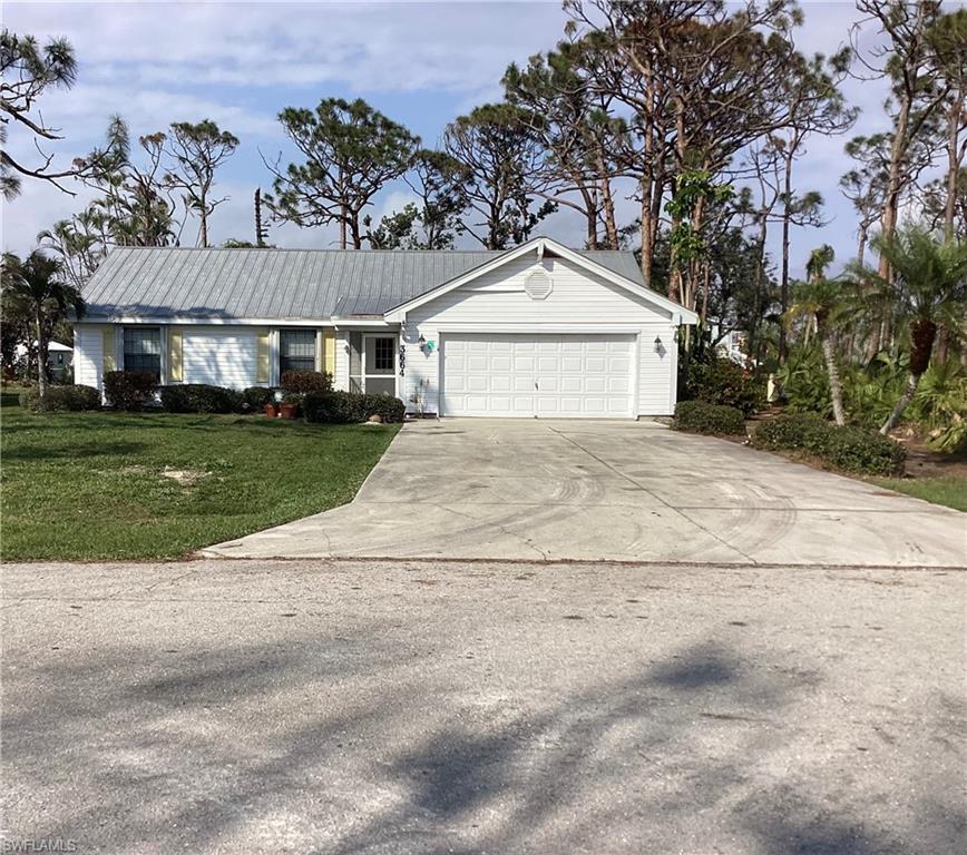 Welcome to Tropical Homesites located in St.James City. This area offers large lots and a community park with BBQ grills, picnic tables and a small beach area where you can enjoy the beautiful views of Matlacha Pass. This three bedroom two bathroom home was damaged by Hurricane Ian. Inside the damaged drywall, flooring and appliances have been removed. Outside some of the vinyl siding is missing.