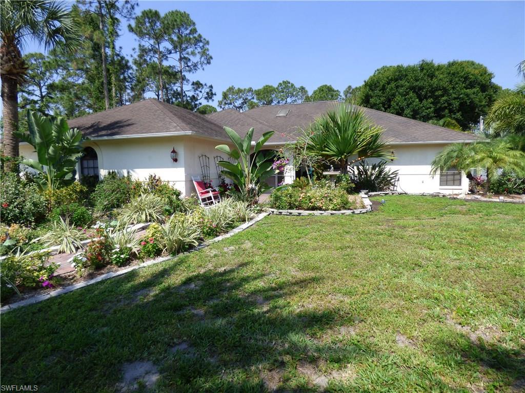 2000 square feet of living area in this beautifully landscaped pool home on park like half acre lot, SELLER WILL INSTALL A NEW 30 YEAR DIMENSIONAL SHINGLE ROOF PRIOR TO CLOSING, cleared and fenced backyard, plenty of covered and open deck space around screen enclosed in ground pool, oversized 650 square foot side entry double garage, plenty of concrete drive for extra parking, flower lined sidewalk leads to the front dbl door screened entry-a gardener's paradise, cathedral ceilings, plant shelves, skylights for natural light, formal dining room, built in bookshelves in living room with halogen accent lighting, newer wood laminate and ceramic tile floors, new ceiling fans including two exterior fans on lanai, new light fixtures, commodes and faucets in bathrooms, crown molding, large kitchen with nook area, solid surface countertops, pantry, breakfast bar, wet bar with sink and built in wine rack,  master bedroom with skylight, walk in closet, French doors to lanai that can be enclosed, glass block accents in master bath with jetted garden tub, separate shower and dual sinks, built in Murphy bed in guest bedroom, storage shed, new central heat and air in 2015, indoor laundry room,