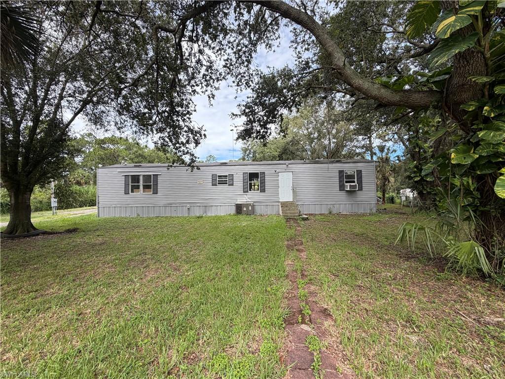 Up for sale is this 1.25 fenced in property in Southern Montura Ranches including a 2-bedroom 2-bathroom SW Manufactured Home with 896 sq ft. Home has been renovated but does need to be finished needing a little TLC with minor things left but being sold as is. There is a porch addition on the back where the washer and dryer go. Tankless water heater. New porcelain tile throughout the home minus one bathroom. Master bedroom has a shower. Property has two small shacks for storage and chicken coop. Mature oak trees and on a paved road. Priced low to sell. Make your cash offer todays! This rural horse and golf-cart friendly community is growing, get in while you can. Horses OK. Plenty of space for your toys. Sits on a paved road Mayoral St. No HOA's and pay no city taxes. 1.5 hour from each coast. Call to schedule your private showing today.