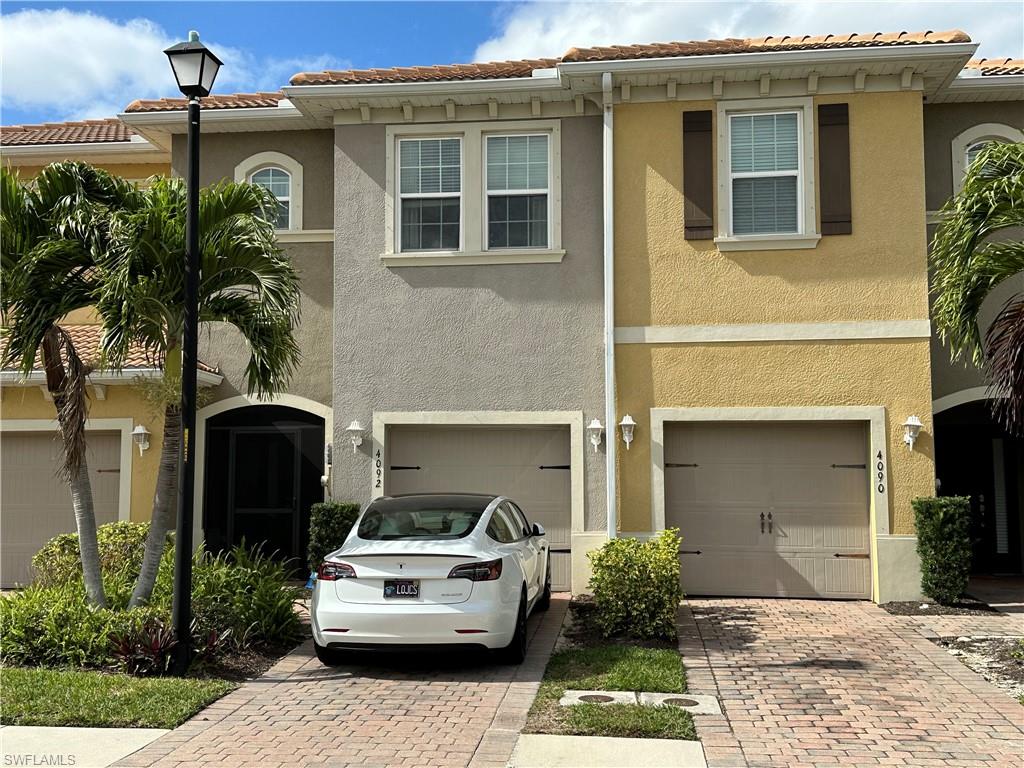 Truly Stunning Townhouse ~ 2 HUGE Bedrooms ~ 2 & 1/2 Bathrooms ~ 1 Car Garage ~ Open Floor Plan ~ Gated Community ~ Community Pool ~ Massive and Amazing Walk In Closets ~ Screened Lanai ~ View of Water Feature and Pond ~ Stainless Steel Appliances ~ Vast Pantry ~ Dark 42" Kitchen Cabinets ~ Stunning Quartz Countertops ~ Plenty of Storage Area ~ Inside Laundry, Located on 2nd Floor (No running up & down the stairs) ~ Location is Incredible ~ A unbeatable central location in Fort Myers. ~ Only minutes from Colonial Blvd and I-75, shopping, dining, and entertainment. ~ RSW International Airport is approximately 20 minutes and offers the convenient access to the beautiful Historic Downtown River District downtown.