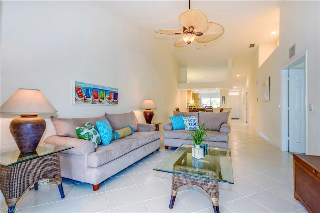 Magnolia Falls, in Falling Waters, is a "resort like" community. With it’s enormous resort style pool and amenities galore, this development has it all! Entering this 2 bed 2 bath second floor home, the vaulted ceilings give it a “grand” feeling! There is new carpet in both bedrooms, and light tile on the diagonal in all other areas. The open kitchen, with eat-in area and breakfast bar, looks over the dining /living room, and through the sliding glass doors to the wooded and landscaped outdoor space. Your “master suite” has a large walk in closet just off the master bath, and separate sliders lead straight out to the newly painted screened in lanai. During the day, enjoy the privacy and solitude of your expansive lanai, with the sound of the waterfall feature in your back yard. In the evening, just sit back with your favorite beverage and watch those beautiful Naples sunsets. Investors! Renters are allowed pets. Easy to show!