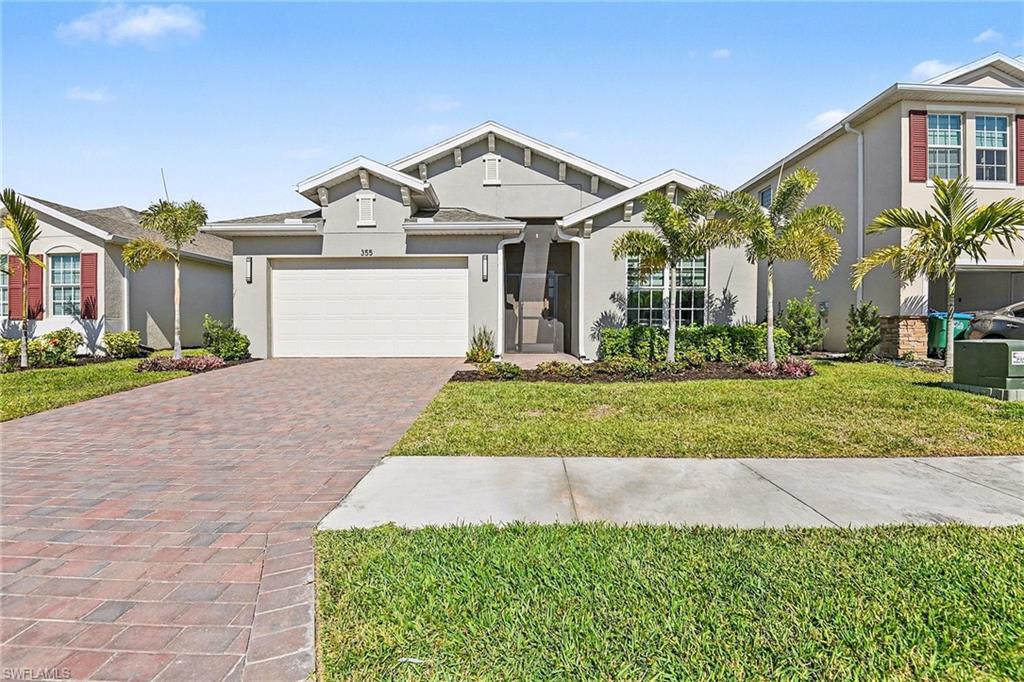 Amazing one of a kind lakefront house in Stonewater. This 3 bedroom plus den, 2 and a half baths, OVERSIZED 2 car garage built in 2024 boasting over 2200sf of living space, large kitchen with granite stainless appliances, great room floor plan with high tray ceilings, spacious master bedroom with custom closet and additional mini split system, large master bath with soaking tub, generous sized guest rooms with LVT flooring, amazing laundry room with extra fridge, loads of outdoor living space on the screened lanai overlooking the lake. So many extras including low HOA fees, community pool and fitness center, NOT IN A FLOOD ZONE, heat pump water heater, 32 FEET DEEP GARAGE, mini split in garage, entire house filtration system, hurricane impact windows and so much more. There isn't another house in the community like it!! In an area of newer homes close to restaurants, shopping and schools!!