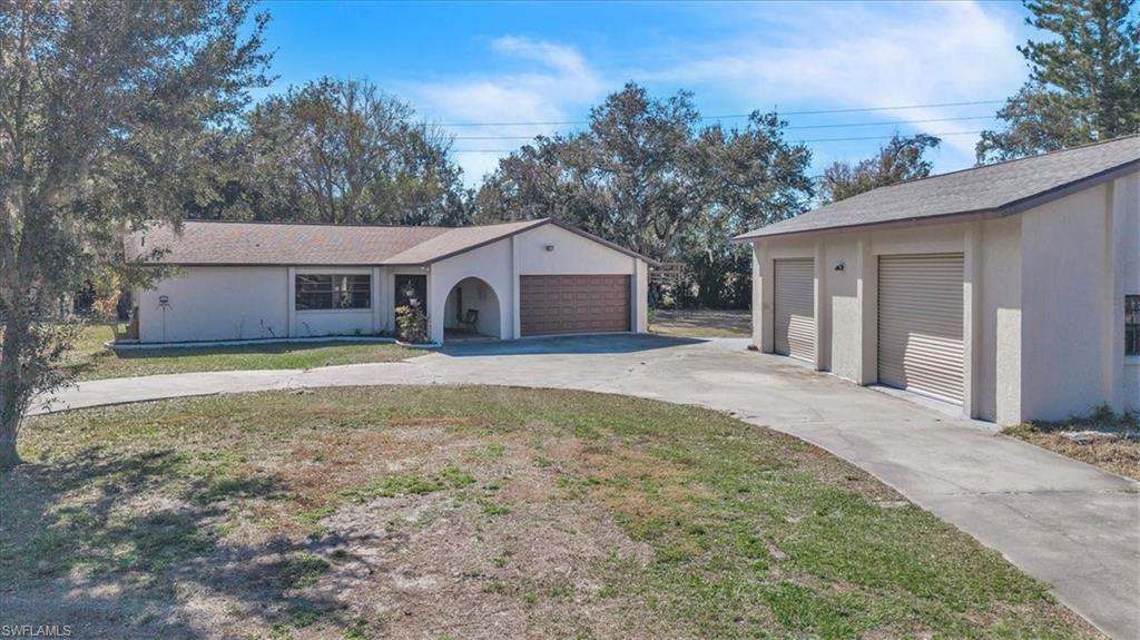 Welcome to this charming home in southeast Arcadia, where space, privacy, and comfort come together. Set on a generous 1.44 acre lot, this property offers room to spread out, enjoy the outdoors, and create the lifestyle you’ve been dreaming of whether that means space for animals, hobbies, or simply a little extra breathing room. There have been many major improvements to the house giving you peace of mind from day one. Recent improvements include a newer roof, A/C system, hot water heater, new counter tops, screened-in porch, fresh interior paint, New garage door and updated appliances. Inside, the home features a bright, open layout with split bedrooms and abundant natural light. French doors welcome you into the foyer and continue through the living and dining areas, opening to the newly screened back porch where greenery and shade create a relaxing outdoor retreat. Additional highlights include a brick wood-burning fireplace, a dedicated laundry room, a mud room, and thoughtful storage throughout. The west side of the property offers a separate entrance to the home, ideal for added privacy or future outdoor enhancements. A standout feature is the approximately 1,100-square-foot detached garage with double bay doors, providing excellent space for a workshop, storage, or recreational toys. Located just outside of town, this home offers a peaceful setting while still being close to shopping, dining, and daily conveniences. Septic, irrigation, and drain field were updated in 2016. With solid upgrades already in place, all that’s left is to add your personal touch and make this home your own. Schedule your own personal tour today!