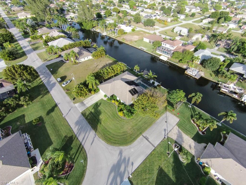 Must see this Gulf Access Home in most sought after Pelican neighborhood. 3 Bedroom 2 Bath Pool home. Open floor plan with Eat in Kitchen, Formal Dining room, Separate Family room and Living room. All on lush tropical oversized corner lot. Relax by the pool or fish on the dock. Children can walk to school.   Priced to sell!