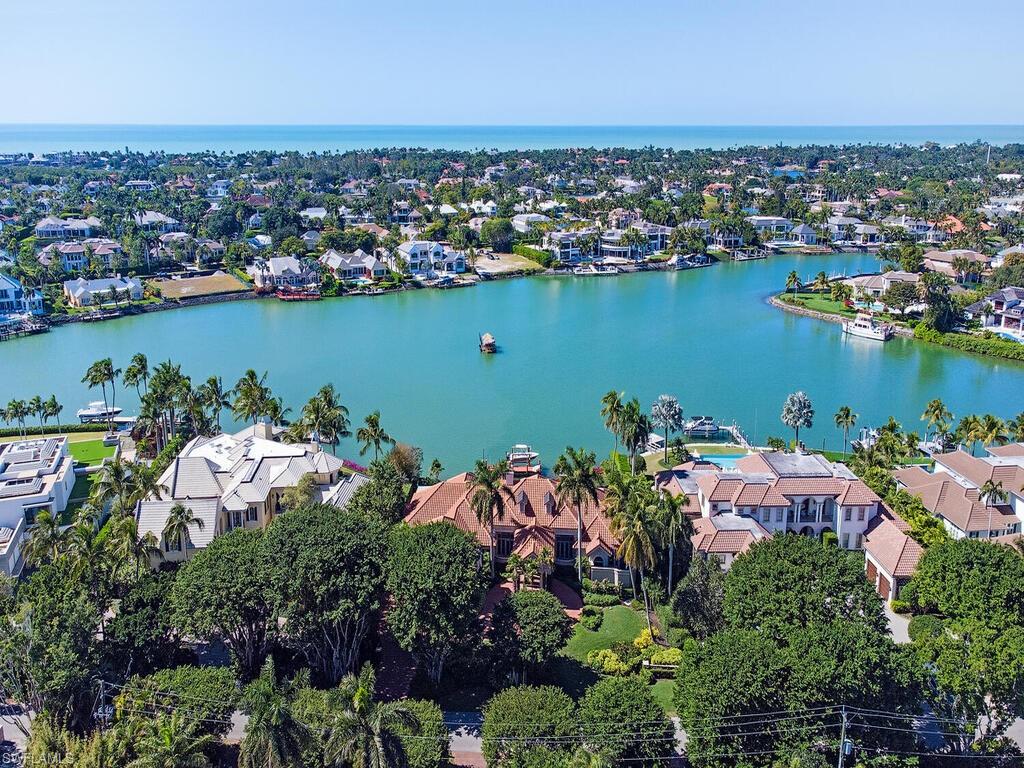 Boaters paradise! Enjoy outstanding panoramic wide water views with 153 ft. of water frontage.Western exposure for beautiful sunsets. This exceptionally well maintained property is perfect for entertaining. The open floor plan encompasses multiple living areas that flow seamlessly from the indoor space to the expansive outdoor living areas including lanai with a retractable screen and gorgeous resort style pool. This custom residence is ready for your design and finishing touches to create your dream home. This desirable property is finished with a pristine dock with boat lift and jet ski lift. Ideally located in prestigious Port Royal in just minutes from 3rd Street South’s and 5th Avenue South's fine dining, world-class shopping and white-sand beaches. Port Royal Club membership eligibility.