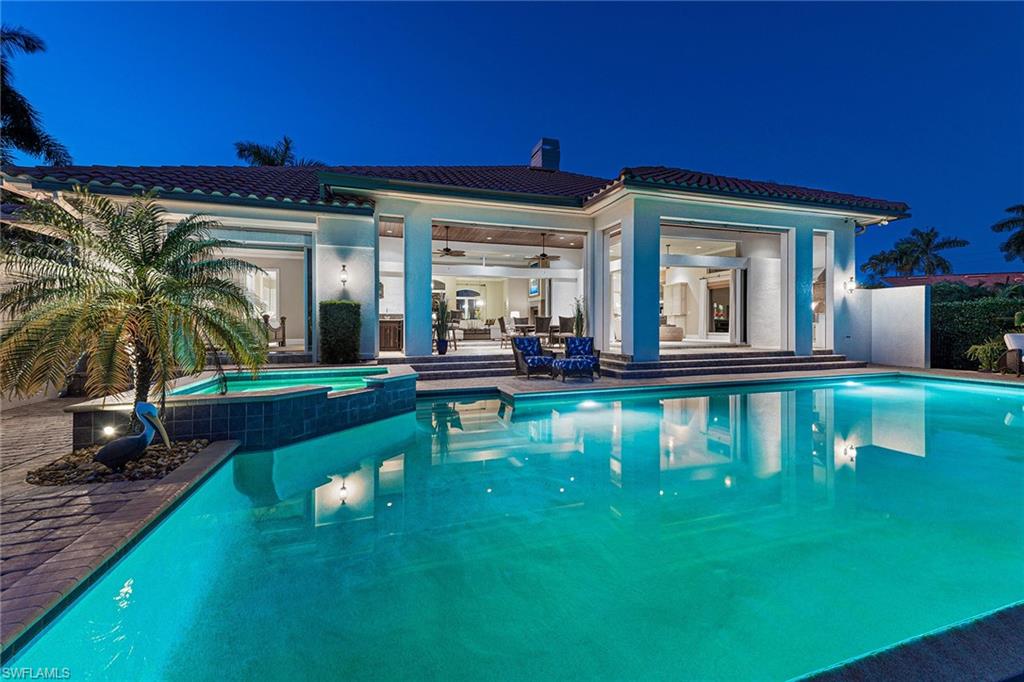 Immaculate split floor plan, “smart home” with spectacular wide-water views has everything. Residence was built by Coleman Homes and updated in 2008 with complete storm protection, including a whole house generator. Home features a gas fireplace, high ceilings, chef's kitchen with top-of-the-line appliances, 5-burner gas stove, wine cooler, oversized refrigerator and an abundance of counter space. Entertaining has never been easier with expansive outdoor living space including a 42-foot saltwater infinity edge pool/spa with new pool pump and lighting, updated in 2019. A 16,000-pound boat lift and 40-foot dock provide direct water access. Smart home automation allows remote access and control of all systems, including pool & spa controls, cameras, lighting, cooling/heating, water heater, automatic water shut-off, security system, door locks, water fountain and smart (weather aware) irrigation. 3 new high-efficiency A/C units, new ductwork and new, high-efficiency hybrid water heater installed in 2019. Whole house water filtering and insurance approved water leak monitoring system installed in 2020. Residence is finished with an air-conditioned garage with workbench and storage area.