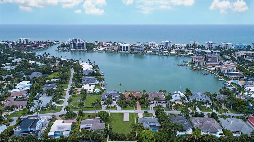 Incomparable Moorings opportunity just reduced for immediate sale. This fully cleared lot is situated on one of the best streets in the Moorings and is positioned right across from the "Nifty Fifty" waterfront homes. Survey, soil test, and building plans are available and if used would save someone approximately 8 months of planning. Highly coveted Moorings Private beach access is available with this parcel.