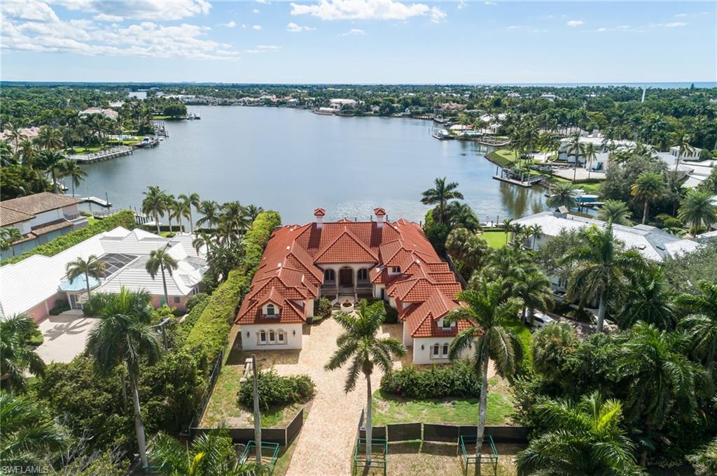 Some views transcend description; this one must be seen to be believed. To stand on this property is to understand why opportunities like this arise only once in a generation. A sight so captivating it can only be appreciated in person. An irreplaceable crown jewel that epitomizes Port Royal’s timeless allure. Distinguished by its unrivaled setting within Port Royal, this waterfront estate site embodies both enduring investment wisdom and the aspirational lifestyle that defines Naples' most coveted enclave. Perfectly situated in the heart of this world-renowned community, it presents an irreplaceable opportunity to craft a home that captures the essence of luxury coastal living at its highest expression. Spanning more than half an acre with direct southern exposure and mesmerizing long water views, the property commands the widest canal in all of Port Royal, an extraordinary vantage rarely offered. Its tranquil, dead-center position ensures complete serenity, free from commercial traffic or noise, creating a private setting defined by sunlight, open water, and profound calm. Port Royal remains the benchmark for refined prestige. Here, legacy estates and modern architectural masterpieces coexist along deepwater canals leading directly to the Gulf, while tree-lined streets and manicured grounds reflect a standard of living found nowhere else in Florida. The new $100 million Port Royal Club, set to debut in 2026, will redefine oceanfront luxury with world-class dining, a wine gallery, spa-level wellness amenities, and grand gathering spaces shaped by West Indies-inspired design. Already fueling renewed buyer demand, the Club’s reconstruction stands as a catalyst for long-term appreciation and enduring desirability within the community. As new construction continues to set record thresholds beyond $40 million, this rare property offers the ultimate blank canvas for a bespoke waterfront estate. For those who value discretion, tranquility, and timeless luxury within Naples’ most distinguished address, there is simply no equal.