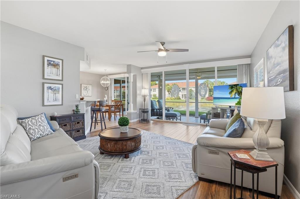 Tucked inside the beautifully landscaped, nature-rich community of Lighthouse Bay in Estero, this first-floor 3-bedroom, 2-bath end-unit carriage home is offered turnkey, making it easy to move right in or keep ready for seasonal use. The interior has been thoughtfully updated and well maintained, featuring wood-look tile flooring throughout the main living areas and third bedroom, fresh interior paint, and a clean, modern feel. The kitchen is equipped with newer Whirlpool appliances, soft-close drawers, and a layout that flows easily into the main living space. Both bathrooms have been upgraded with quartz countertops, with the primary suite offering dual sinks and a walk-in shower with a hinged glass door, while the guest bath includes a soaking tub. Additional features include impact windows, plantation shutters, and electronic retractable storm shutters, along with a 2-car attached garage. The western rear exposure captures warm afternoon and evening light and offers a relaxed lake view. Lighthouse Bay spans 162 acres and is designed to blend with its natural surroundings. Residents enjoy three miles of walking paths, a community garden, freshwater beachfront area, and a dock with paddle boats, canoes, and fishing boats. Amenities also include a lagoon-style pool, enclosed lap pool, spa, sauna, public BBQ areas, six hydro-grid clay tennis courts, bocce courts, and a fully equipped fitness center with locker rooms. The 2,500 sq. ft. arts and learning center features a library, card room, studio space, and business center. This property includes a Bronze Membership to The Commons Club, providing access to the Rookery Restaurant, social events, and pickleball courts, with options to upgrade for additional amenities, including the beach club (currently under construction). Ideally located in Estero, you’re in close proximity to Coconut Point Mall, Hertz Arena, Florida Gulf Coast University, Southwest Florida International Airport, and the beautiful Gulf beaches. This is an opportunity to own a move-in-ready home in one of Estero’s amenity-rich and naturally scenic communities.