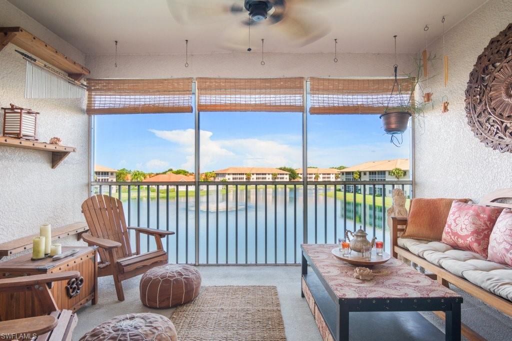 A MUST SEE POLYNESIAN PARADISE! This stunningly turnkey, FULLY FURNISHED, condo has everything you need and more! 2 bedrooms, 2 bathrooms, and 1,304 sq. ft. of pure relaxation. Whether this is your primary home or your vacation getaway, you and your guests will enjoy your very own luau on the balcony overlooking the scenic lake, fountain and your community pool. Custom wood beams and grasscloth paneled ceiling and walls cover the great room.  Rest easy and cool, since the A/C was just installed in 2019! Your Primary Bedroom suite has a double vanity and walk-in closet. Located in the gated community of Blue Heron, this third-floor unit sits directly across from elevator, comes with assigned, covered parking, on-site management, and a community clubhouse. Plenty of guest parking, and low HOA fees. Only 7 miles from Downtown Naples 5th Ave South, and 8 miles from the Naples Pier Beach... this must see unit won’t last long! Everything you see is included! (See agent remarks for specific personal items that do not convey)