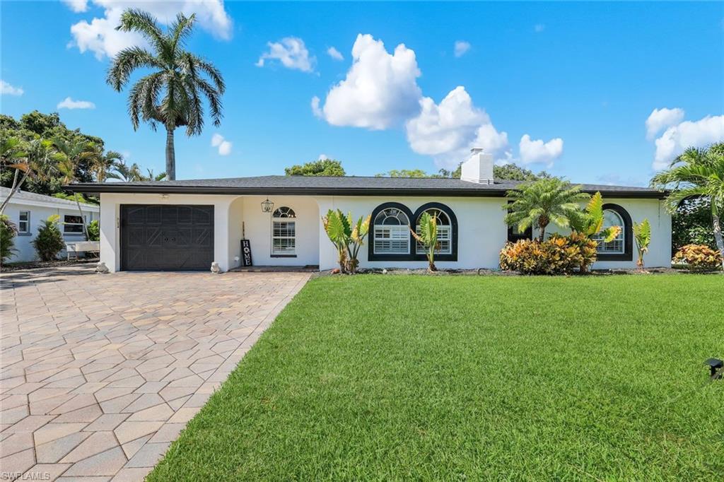 Discover the epitome of Southwest Florida living in this expansive 5 bedroom, 4 bathroom pool home, ideally situated on the highly desirable river side of McGregor Boulevard. Enjoy a spacious, thoughtfully designed floor plan that offers exceptional flexibility for large families, multigenerational living, or those seeking dedicated work from home space.

The inviting interior is filled with natural light and features granite countertops, stainless steel appliances, abundant cabinetry, and a classic wood burning fireplace that serves as the centerpiece of the main living area. With five generously sized bedrooms and four full bathrooms, this home provides the perfect balance of comfort, privacy, and functionality.

Designed for both everyday living and entertaining, the outdoor spaces are equally impressive. A large paver driveway offers ample parking and leads to the attached one car garage, while the fully fenced backyard creates a private tropical retreat complete with mature palm trees, automatic irrigation, a sparkling inground pool, and an expansive paver deck for relaxing or hosting guests.

Adding incredible versatility is the detached, climate-controlled 1.5-car garage with built-in overhead storage—ideal as a workshop, fitness studio, art studio, hobby space, additional storage or in law suite.

Located in one of Fort Myers' most established and sought-after neighborhoods, this exceptional property is just minutes from the historic Downtown River District, waterfront dining, boutique shopping, parks, and the beautiful Gulf beaches. Combining generous living space, versatile amenities, and an unbeatable location, this is a rare opportunity to own a truly exceptional Southwest Florida home.