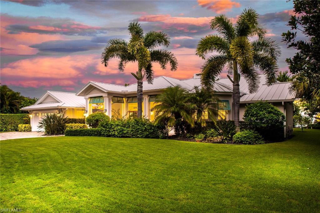Own a piece of paradise in the highly sought-after Seagate neighborhood. This home features New Flooring, updated kitchen with new appliances, and high-end details throughout. Over 3,600 square feet of air-conditioned space. The living room and dining room are separated by a large fireplace, the family room features a glass wall overlooking the canal with a vaulted ceiling along with 3 bedrooms, large study, air-conditioned storage, oversized two-car garage, screened lanai with large covered area that features a bar, summer kitchen with Viking gas grill along with a raised spa and large pool. The waterfront area includes a large paver patio with plenty of room for waterfront dining and lounging alongside the dock with a floating ramp for a boat and a second floating ramp that will accommodate two jet skis. Kayak, canoe paddleboard and fish right from your backyard. Enjoy water access to Outer Clam Bay and the Gulf of Mexico. Residents can join the Seagate Beach Club Association, a private beach club only for Seagate residents that provides gated parking, covered picnic pavilion, restrooms, grill area, outdoor shower, as well as private beach access. This home is a MUST SEE!