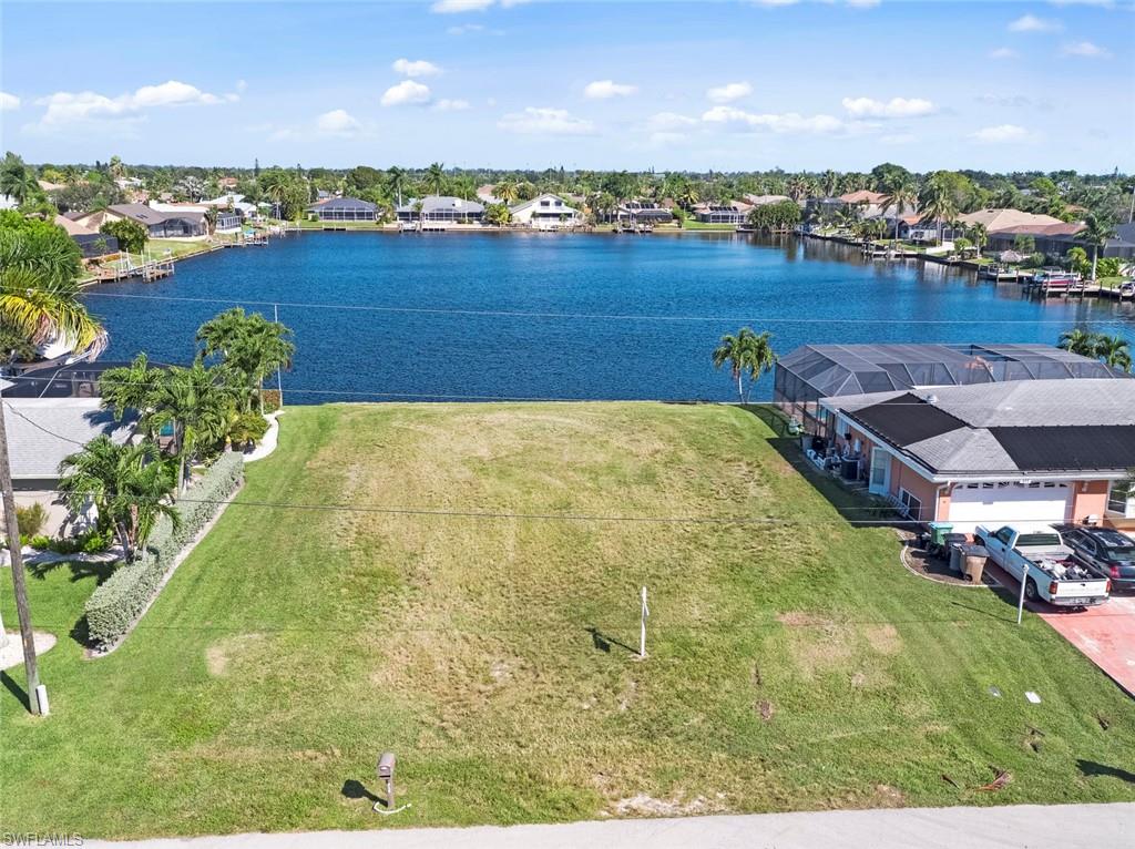 NEW PRICE!!  Beautiful view of Lake Yuma.  This gulf access canal/lake lot has the seawall in and ALL ASSESSMENTS PAID! Centrally located in SW Cape Coral and close to everything you need to enjoy the Florida Lifestyle.  Set in an established neighborhood of well maintained homes and ready for your dream home!