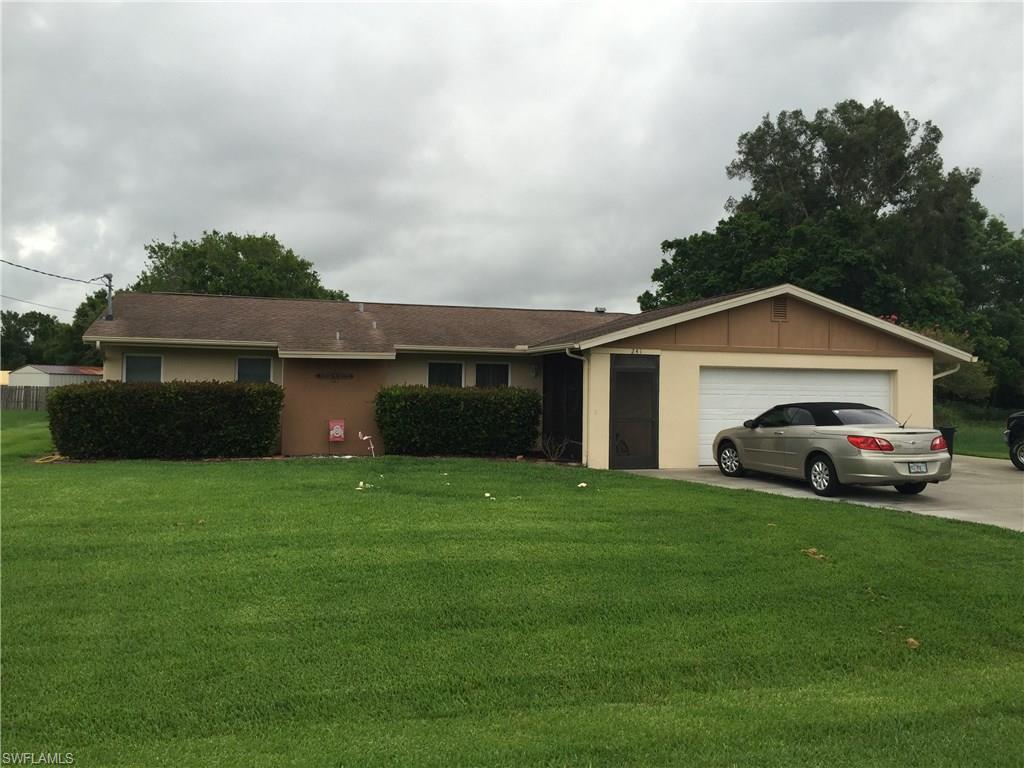Charming well kept home in quiet area of N.Ft.Myers. Home features woodlook tile throughout entire home! Freshly painted interior and a pool deck encompassing a HUGE above ground pool! Separate his and her closets in Master. Brand NEW storage in back of Pool big enough for a car! NEW concrete walkway from driveway to Storage unit. Huge lanai for entertaining as well as separate dining area! Crown molding just installed!! Priced to sell! Don't miss out on this GEM!