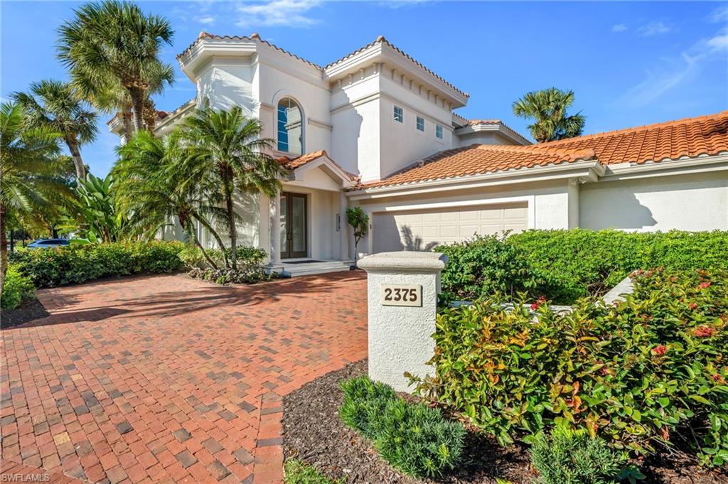 An exceptional opportunity awaits in Grey Oaks Country Club…an elegant, two-story residence which lives like a coach home, offering a graceful balance of privacy, comfort, high ceilings and effortless sophistication, all enhanced by serene south-facing views. Built in 2000 and offering 2,699 square feet, the home features three bedrooms and three full baths, all ensuite, along with a private elevator—an uncommon and thoughtful convenience. Recently repainted interiors, high ceilings, and an open, light-filled layout create an atmosphere that is both refined and welcoming. Offered furnished, the residence is ready for immediate enjoyment. The spacious kitchen is both classic and functional, featuring granite countertops and abundant cabinetry, and opens seamlessly to the family and dining areas. Sliding glass doors lead to the lanai, where tranquil water-feature and clubhouse views set the stage for relaxed mornings and elegant evenings. The primary suite is a serene retreat with direct lanai access, dual walk-in closets, and a well-appointed bath with dual vanities, soaking tub, separate shower, and private water closet. Two additional guest suites, each with walk-in closets and ensuite baths, offer comfort and privacy for family and friends. Outdoor living is elevated by a south-facing lanai and the rare inclusion of Cabana #6, ideally located by the pool and featuring a generous common area, full bath, and kitchenette—perfect for hosting guests or enjoying a resort-inspired day just steps from home. Grey Oaks Country Club offers a vibrant, wellness-oriented lifestyle with two clubhouses, three restaurants, and a 30,000-square-foot Wellness Center, complemented by three championship golf courses, resort-style pool, tennis, pickleball, bocce ball, and beautifully landscaped grounds—all within a guard-gated setting minutes from Naples’ beaches, shopping, and dining.n This is a rare opportunity to purchase a 2nd-floor, beautifully maintained residence in Grey Oaks, so close to the Club amenities—where refined living, wellness, and wonderful Member-connections come together. Welcome home!