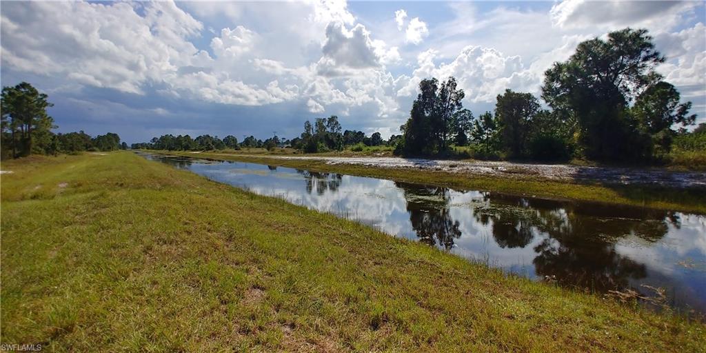 Large lot in a neighborhood of beautiful homes located in a quiet area of Lehigh Acres, FL.  Easy access to all the amenities of Lehigh and near Fort Myers.  Make this your waterfront homesite for your dream home or add this lot to your investment portfolio as lot prices continue to increase.  This is not a flood hazard area and property is high and dry.