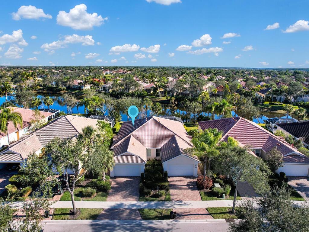 New to the market - this light and bright three bedroom attached villa with a lake view in Village
Walk of Bonita Springs, a gated resort style tennis community is ready for you! The popular
Carrington floor plan features ceramic tile floors in the living areas, laundry sink in the laundry
room, 2-car attached garage and a newer air-conditioning system. This house has only been
occupied by the original owner since it was built (no rental). It’s been well maintained and is kept
immaculate. The furnishings are negotiable too! Enjoy watching the sun rise across the water from
the screen enclosed lanai. The primary suite includes a large closet & dual sinks. The Town Center
has numerous amenities including a gas station, touchless car wash, tennis, pickleball, basketball
and bocce courts, playground, world class fitness center, restaurant, bagel shop, hair salon, spa &
full time lifestyle director! Lawn maintenance, irrigation, internet and cable TV are all provided by
the HOA. Located just minutes from Naples, Fort Myers, beautiful beaches, world-class shopping,
International Airport, parks, dining, museums, galleries & entertainment! Ask about special
financing options!