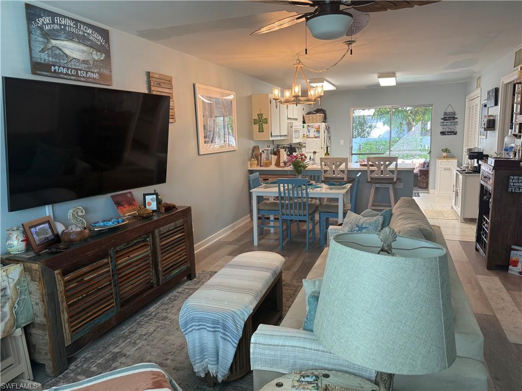 This newly redone condo is perfectly priced for its location across from Smokehouse Bay and in the heart of downtown Marco Island with walking access to restaurants and shopping. Concerts at Vererans Park Pavillion and ownership  in Marco Island provides access to the beautiful white sand beaches of Marco Island's exclusive Residents Beach. New painting and new flooring, new washer and dryer. New central air conditioning in 2023. Wainscoated powder room.  Corner fireplace.  Easy walk to Sand Dollars almost private pool for easy relaxing and sunning on the non-beach days. The home can be rented  3 times a year if you choose with a 30 day minimum. Tranquil screened back porch. Very affordable monthly fees. You will wonder why you ever lived anywhere else except Marco Island.