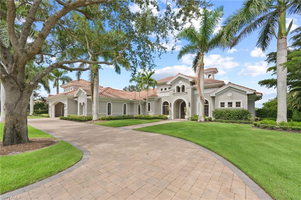 Exquisitely designed with soaring, coffered ceilings as you enter the double, glass paned front doors to the beautiful foyer offering stunning views of the craftsmanship details to the fabulous exterior views overlooking your lanai, pool/spa and to the golf course and lake beyond. Inside, you will be immersed in luxury as you enjoy a gas fireplace flanking the formal living room to the fabulous kitchen detailed with an abundance of workspace, island, and Wolf appliances and overlooking the breakfast nook and family room with zero corner sliders leading to the fantastic lanai.  There you will appreciate the built in outdoor kitchen, seating area and the lovely, coffered ceiling. The pool/spa and gas fire pit are open for wonderful starry nights and fabulous entertaining.
With 4 bedrooms, all ensuite, den and media room, you and your family and guests will appreciate the privacy of personal spaces and the 3-car garage with a portico allows plenty of spaces for your treasured vehicles.