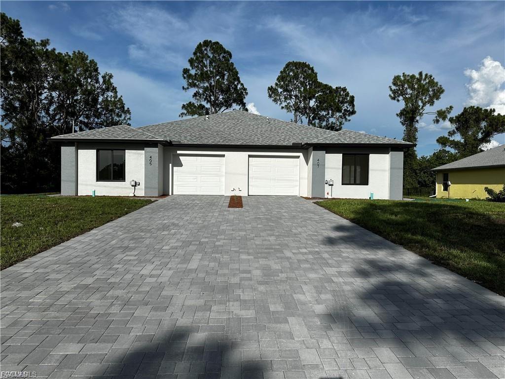 Great location !!Wonderfull new construction property at outstanding value.From the moment you step on the property you will notice the great craftsmanship. Open layout with attention to details and elegance. This property truly depicts the Florida lifestyle filled with sunshine and good vibes. Excellent location 3 bedrooms , 2 bathrooms each side with 1 car garage. Living Area 1193 sf and Total Area 1610 sf each side. Property is loaded with upgrades including :Impact Resistance glass doors and windows, 32"x32" porcelain tile through , wood cabinets with soft close,Quartz countertops, high-end lighting, multi tray ceilings, brick paved driveway, electric garage door opener, tall wooden base boards, 8-foot doors throughout. Master suites with large walk-in closet.Spacious laundry.Short drive away from shopping centers ,dinning and more.Come and check this one out today!