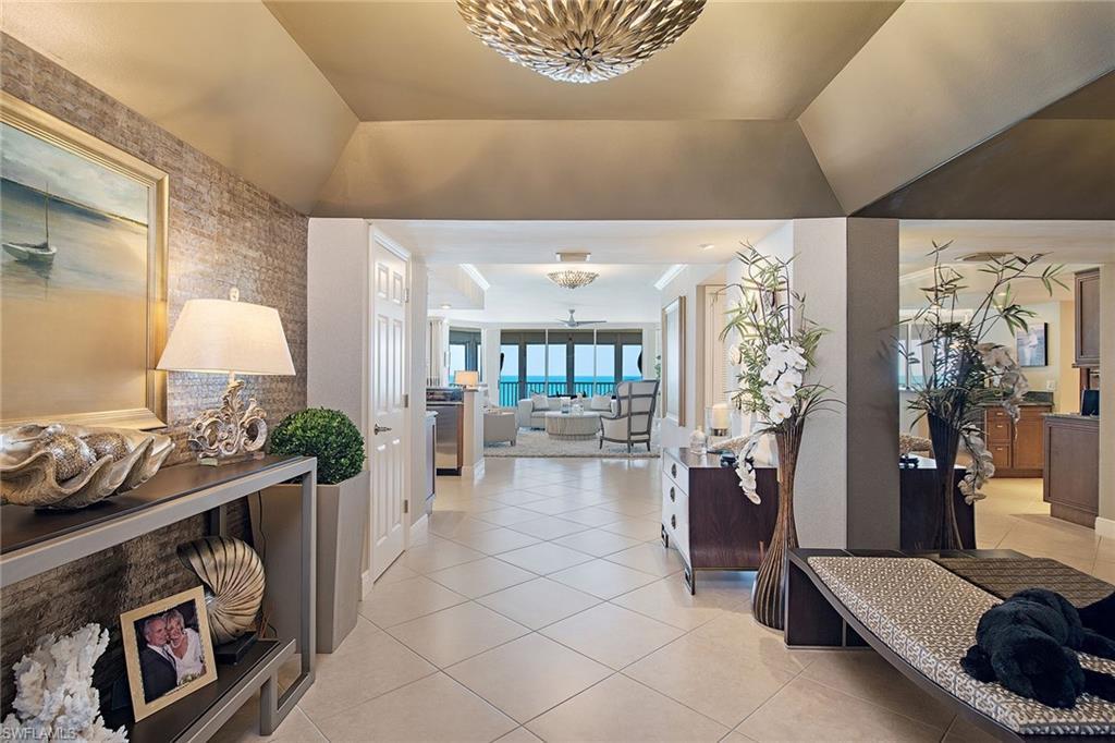 It would be hard to find a better beach view! This rarely available, sophisticated Monaco 01-point residence has three bedrooms and three baths with over 2,900 square feet. It has been stylishly renovated and designer furnished with soft colors of the sea. The generous screened and shuttered lanais capture mesmerizing views of the landscaped park, sandy beach and azure Gulf waters, as well as sounds of the surf and sunsets year-round. The remastered kitchen area with custom cabinetry and an oversized island with induction cooktop, along with many other upgraded features, plus an open bar area, lends to the spacious feel of the entire residence. It lives like a single-family home with two privately located guest rooms and a master bedroom suite with a separate office, all with the most gorgeous Gulf views. The Monaco Beach Club has much to offer with a newly updated beachside pool area, fitness center and social room.  It also offers unique "guest services," affording residents many conveniences not offered in any other beach building. This residence comes with a well-located, deeded covered parking space.