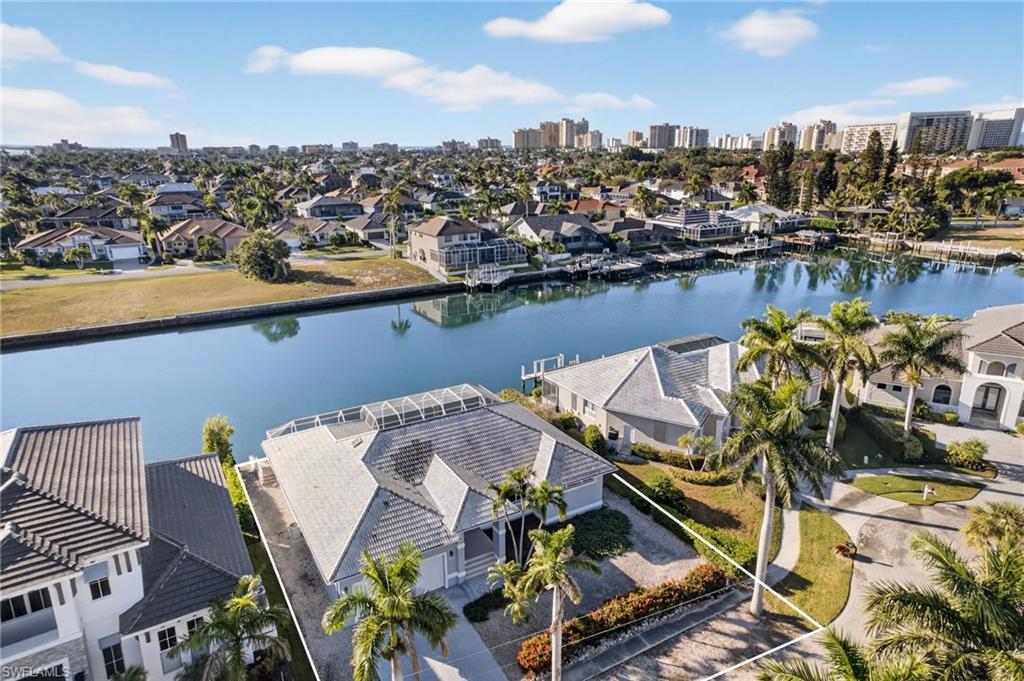 Premier Wide-Water Opportunity on Marco Island's Most Desirable locations. Breathtaking southern-exposure sunsets and quick Gulf access from the island's widest and longest waterway -- just minutes to the beach, dining, and shops. New Seawall and Dock Construction to be completed 6/15/26.
This elevated 3-bed, 3-bath residence with 10'+ first-floor elevation offers an open floor plan, oversized first-floor Primary Suite, and an expansive lanai framing sweeping wide-water views. 
For the discerning buyer, this property presents the perfect option for a stunning renovation or a signature new coastal estate on a gorgeous waterfront lot, maximizing today's most coveted design trends while capitalizing on one of Marco's ideal waterfront settings. 
Should you wish to reimagine this residence at the very highest level, we are well-equipped to provide a seamless path to unlock the best this property has to offer. Your legacy property awaits.