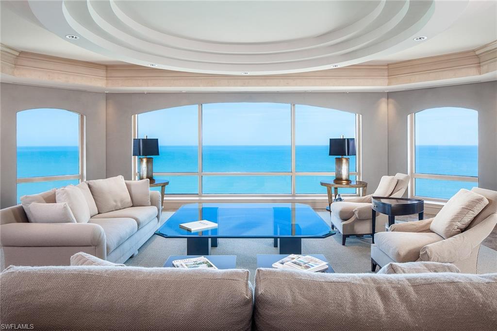 Make the entire 20th floor your new home! For those who desire limitless horizons, you can see for miles through wrap around windows across 360 degree views of the sparkling Gulf waters, sugary white sand beach and Naples Skyline. Encompassing 8,550 sq. ft. of living area with ownership of the entire 20th floor, this residence features a gracious master suite with dual baths, wardrobe closets, office and an exercise room with sauna. The smartly designed kitchen opens to the breakfast area and family room with custom built ins and fireplace. Four oversized lanais totaling 1,560 sq. ft., 2 high speed privately coded elevators, service elevator, pool deck cabana/artist studio and a 3 car enclosed air-conditioned garage. Enjoy living in the prestigious community of Bay Colony and membership in the newly renovated Beach and Tennis Clubs.