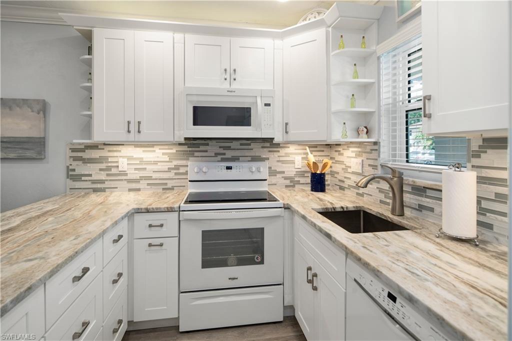 WOW!  GORGEOUS TURNKEY FIRST FLOOR 2 BEDROOM CONDO LOCATED JUST ACROSS THE STREET FROM THE WORLD FAMOUS MARCO ISLAND'S CRESCENT BEACH.  STUNNING OPENED KITCHEN WITH ONE LEVEL DESIGNER GRANITE AND STYLISH GLASS BACKSPLASH, AND FEATURING NEW WHITE SHAKER STYLE CABINETRY AND APPLIANCES.  NEW CUSTOM VINYL PLANK FLOORING THROUGHOUT.  NEW MINI SPLIT CENTRAL AIR CONDITIONING, AND IMPACT GLASS WINDOW AND DOORS. DECORATED IN THE BEACH COASTAL THEME THIS UNIT IS A TRUE BEAUTY.  THE LOCATION OF THIS CONDO IS PREMIER NEXT TO THE GRILLING AREA, LAUNDRY AND STORAGE WITH THE PARKING SPACE RIGHT OUTSIDE THE FRONT DOOR.  DON'T MISS THIS ONE!