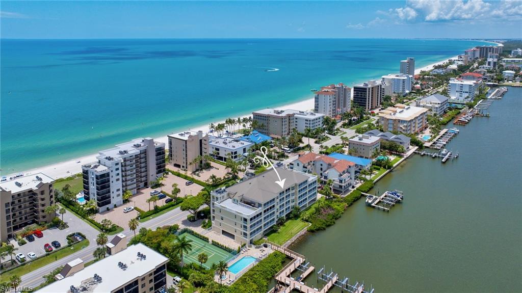 Welcome to your private waterfront retreat in the prestigious Watermark at Vanderbilt Beach, where sophisticated coastal living meets effortless luxury. Perfectly positioned on the fourth floor, this impeccably renovated residence offers breathtaking panoramic views of Vanderbilt Bay while providing deeded access to the pristine white sands of Vanderbilt Beach just moments away.
High and dry through Southwest Florida’s recent major storms, Watermark offers exceptional peace of mind while preserving the unmatched waterfront lifestyle buyers seek.
Thoughtfully redesigned with timeless elegance, the open-concept floor plan is filled with natural light and showcases premium finishes throughout. The gourmet kitchen is a true centerpiece, featuring quartz countertops, custom cabinetry, stainless steel appliances, and seamless flow into the spacious living and dining areas—ideal for both intimate gatherings and entertaining.

The screen-enclosed lanai extends the living space, creating the perfect setting to enjoy tranquil sunrises, sparkling bay views, and the gentle coastal breeze year-round. The luxurious owner’s suite offers a peaceful waterfront sanctuary complete with a beautifully updated spa-inspired bath and generous closet space. A split-bedroom layout provides exceptional privacy for family and guests.
Residents of Watermark enjoy secured under-building parking, a bayside resort-style pool and spa, pickleball and tennis courts, barbecue and picnic areas, private beach access, and beautifully maintained grounds. Ideally located just minutes from The Ritz-Carlton, LaPlaya Beach & Golf Resort, Mercato’s premier shopping and dining, fine restaurants, and world-class entertainment, this exceptional residence delivers the very best of the Naples waterfront lifestyle.
Whether you’re seeking a full-time residence, seasonal escape, or luxury investment opportunity, this move-in-ready home offers an unmatched combination of location, elegance, resilience, and coastal sophistication.