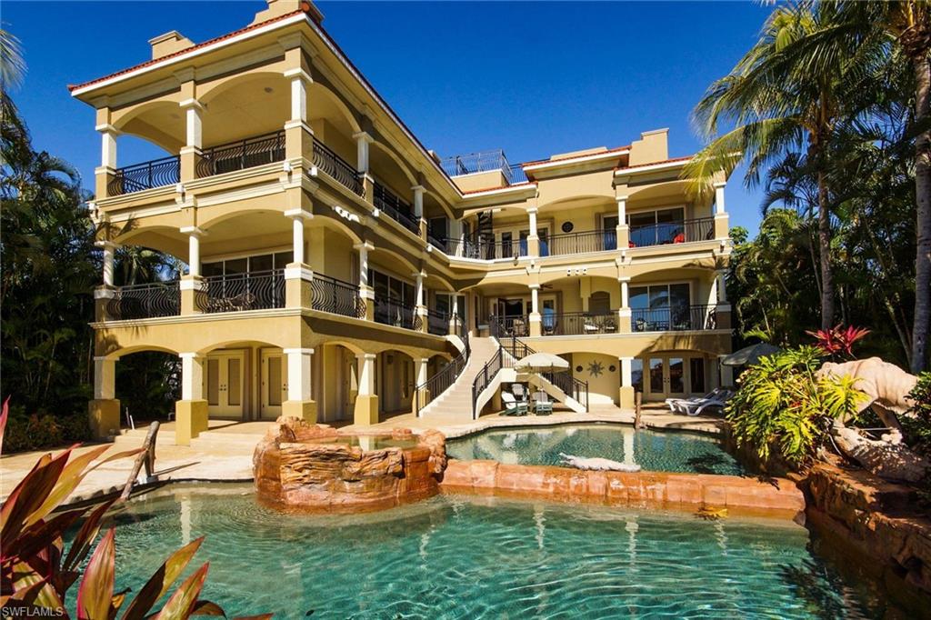 This is a VACATION RENTAL only. Owner will not consider annual rentals. Weekly rentals are welcome.
The Winslet Estate is a 5-bedroom, 5 & 2 1/2-bathroom three story resort-style property located on the Caloosahatchee River with an electric heated pool and spa. This home sleeps a maximum of 14 guests (including children) and is not pet friendly.

Virtual Walkthrough - VIRTUAL TOUR

· · · · · PROPERTY PERKS · · · · ·
- Sauna
- Personal gym
- Bar
- Pool table
- Library
- Elevator
- Spa/hot tub
- High chair
- Boat lift

· · · · · LOCATION · · · · ·
- Located in Southeast Cape Coral
- Close to Rotary Park
- Close to Cape Harbour with waterfront dining
- Close to "downtown" Cape Coral with locally owned shops, bars and restaurants

· · · · · LIVING AREAS · · · · ·
- Ground floor: Sauna, personal gym, full bar with pool table, wine cellar, kitchen area with sink & fridge
- Main floor (entry is on this floor): Open living room with sliders to upper level balcony, family room with a flat-screen TV
- Top floor: open library by balcony

· · · · · KITCHEN & DINING · · · · ·
- Located on main floor
- Fully equipped
- Two ovens
- Two sinks
- Dining area with seating for 8
- Additional room for 3 at breakfast bar in kitchen

· · · · · BEDROOMS · · · · ·
- Primary Bedroom (top floor): King bed, massage chair, wet bar, multiple sliders & desk
- Secondary Ensuite (top floor): Converted office with desk setup, King bed, sliders to the balcony & attached bathroom
- 2 Main Floor Bedrooms: Both with King beds with flat-screen TVs and share a Jack-and-Jill style bathroom
- 1 Ground Floor Bedroom: King bed with flat-screen TV
- 1 Converted Den: Twin bunk beds
- 1 Media Room/Den: Sleeper sofa & flat-screen TV

· · · · · BATHROOMS · · · · ·
- Primary Bathroom (top floor): Soaking tub, walk in shower, two separate sink vanities
- Secondary Ensuite Bathroom (top floor): Shower & single-sink vanity
- Half-Bathroom (main floor): Toilet & sink
- Jack & Jill Ensuite Bathroom (main floor): Shares shower, two toilets
- Half-Bathroom (ground floor): Pool bath
- Guest Bathroom (ground floor):  Shower & single-sink vanity

· · · · · OUTDOOR LIVING · · · · ·
- Electric heated pool & spa/hot tub
- Southern pool exposure
- Dining area with seating for 6
- Sun loungers
- Multiple seating areas throughout the balconies
- Grill
- Boat dock & lift
- Widow's Watch top terrace on the roof is NOT accessible for guests

· · · · · THIS HOUSE IS GREAT FOR · · · · ·
Larger families or group of friends looking for a memorable iconic property on the river with tons of amenities included.