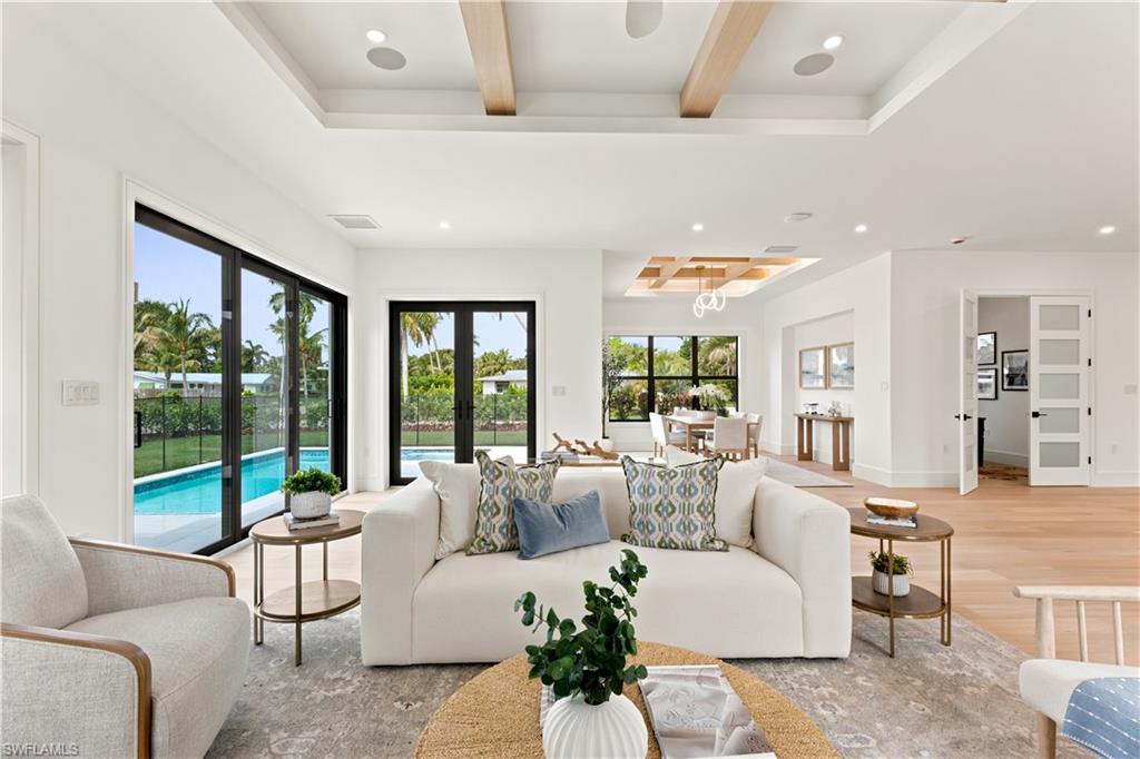 Discover an exceptional new construction opportunity in Sun Terrace, ideally located less than a mile from the beach and minutes from downtown Naples, Waterside Shops, and Venetian Village. This single-story residence offers four bedrooms, two dedicated office/flex spaces, and 3,200 square feet of thoughtfully designed living space.

Natural light fills the open-concept floor plan, highlighting wide-plank white oak flooring, a herringbone entry, custom oak beam details, and refined architectural finishes throughout. The chef's kitchen features custom solid wood cabinetry, quartz countertops, a premium Dacor appliance package, and a fully equipped butler's pantry.

Designed for effortless indoor-outdoor living, the private outdoor retreat includes a custom pool and spa with sun shelf, natural stone decking, and a fully equipped summer kitchen.

Additional features include impact-rated windows and doors, spray foam insulation, a standing seam metal roof, integrated smart-home wiring, underground propane service, a custom pet wash station, and the added benefit of an X-Flood Zone location.

Offering exceptional craftsmanship and an unbeatable location in the heart of Naples, this residence presents a rare opportunity to enjoy luxury new construction in one of the city's most desirable neighborhoods.