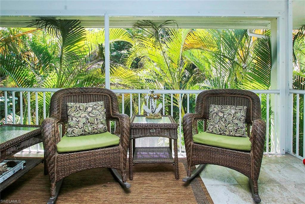 Welcome to the Creme de la Creme at The Colonnades on Sanibel Island! Location, Location, Location, corner, 2nd floor unit, directly overlooking the pool, with additional window in living room facing SW. This light and bright unit is impeccably upgraded and stylishly decorated with trendy islandy decor. Starting with stunning Plantation Shutters throughout the unit, tile plank flooring, quartz counter-tops in kitchen with subway tile back splash, newer appliances and AC units, new custom designed doors and cabinets throughout the unit, quartz vanity in the bedroom, 16" tile on the lanai, along with hurricane windows and doors. Truly amazing rental income, allowing for daily rentals, continually one of the top income generators in The Colonnades. you can have a fabulous location on the quiet East End of Sanibel that's just 300 walking steps to the shell laden beach, a gorgeous turnkey condo and amazing rental revenue. Its going to be hard to find something else this perfect at this price!