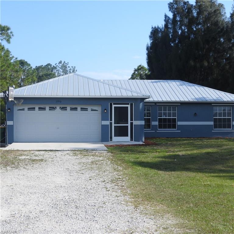 This beauty is back on the market!  LAND  LAND  LAND !!  NO HOA! Welcome to your piece of paradise.  This 3 bedroom / 2 bath / 2 car attached garage home is located on 1.59 acres.  Kitchen has stainless appliances and granite counters.  Pantry in kitchen.  Owners suite has walk in closet.  En suite bathroom has tub/shower combo and updated cabinets. Guest bathroom also has updated cabinets and tub/shower combo.  Linen closet off guest bedrooms.   All closet doors are new in bedrooms.   This lot has plenty of room for your boat, RV, four-wheeler or other toys.  Includes out buildings for storage and an additional garage. All out buildings are permitted as per the county appraiser's office.  There is also a gazebo in the back yard.  This home has lots of updates.  New METAL roof in January 2018, new washer and dryer in 2019, new refrigerator in 2021. Exterior was painted in 2021.  The backyard has plenty of natural shade.  There is also a concrete patio, fenced yard and a generator hook up. Ready for you to move in!