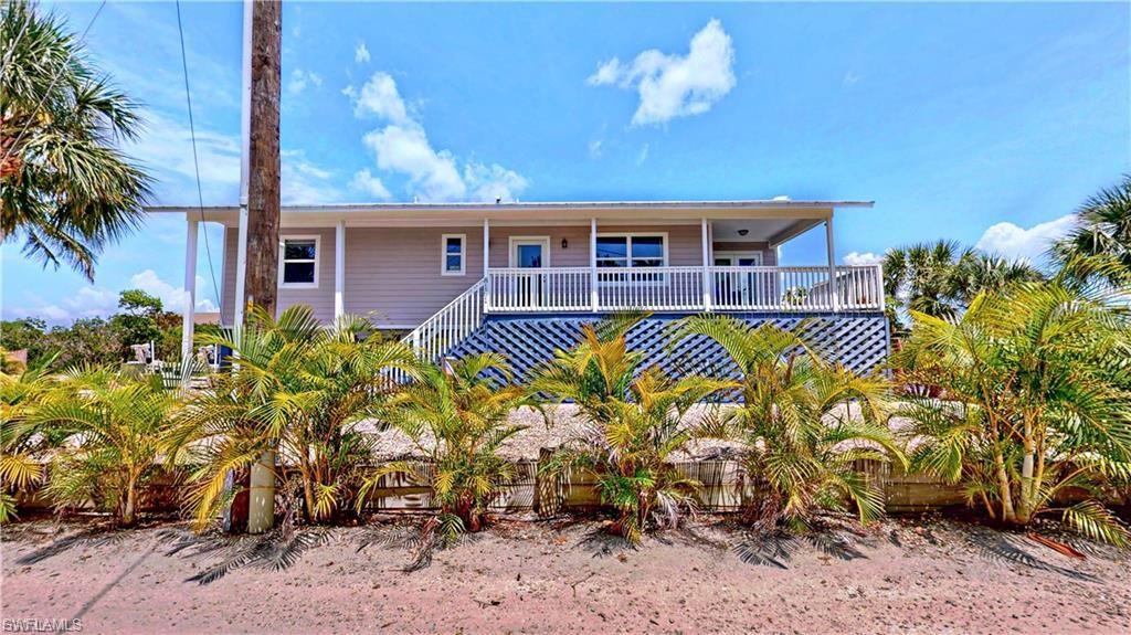 Live the coastal dream in this charming 2-bedroom, 2-bathroom stilt home nestled along a peaceful canal with direct access to Jug Creek and Back Bay. With 120 feet of canal frontage, this property is a boater’s paradise, complete with a 10,000-pound boat lift and ample space to enjoy waterfront living. Upstairs, the open-concept layout is filled with natural light and offers scenic water views. The living and dining areas flow seamlessly into the kitchen, creating an inviting space for relaxation. Both bedrooms are well-sized, and the bathrooms are tastefully appointed. Downstairs, you’ll find a bonus bedroom and bathroom, ideal for guests or extra space. Plus, under the home is a covered area great for relaxing, entertaining, or parking, including a dedicated storage room perfect for tools, gear, and outdoor essentials. For anglers and boaters, the location is unbeatable! You’ll have access to world-class backcountry flats fishing, and it’s only a five-mile boat ride to Boca Grande Pass—home to the best Tarpon fishing in the world. Plus, enjoy manatees and dolphins as they visit you in the canal! Whether you’re looking for a weekend getaway or a full-time residence, this home offers the ultimate in laid-back, waterfront living with quick access to some of the best boating and fishing waters in the area. Don’t miss your chance to own a piece of paradise!