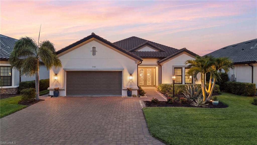 Welcome to exceptional waterfront living in Esplanade Lake Club, where luxury, boating, and resort-style amenities come together to create one of Southwest Florida's most desirable lifestyles. Perfectly positioned on an eastern rear-facing, boatable waterfront lot, this immaculate Pallazio floor plan is nestled on one of the community's most desirable streets, offering minimal traffic, exceptional privacy, and an easy walk to the amenities. Offering 3 bedrooms + den, 3 full baths, this meticulously maintained residence shows like a model and has been impeccably cared for. Thoughtful upgrades include custom trim work, designer finishes, plantation shutters, custom built in closets, hurricane-impact windows and doors, and a hurricane-rated roll-down screen on the lanai for year-round comfort. The versatile den provides the perfect home office or optional fourth bedroom. Designed for effortless indoor-outdoor living, the open-concept great room flows seamlessly to an expansive outdoor oasis featuring an oversized pool deck, sparkling pool, and fully equipped outdoor kitchen ideal for entertaining or simply relaxing while taking in peaceful eastern sunrise views over the water each morning. Boating enthusiasts will appreciate the rare U-shaped wraparound dock, offering outstanding functionality with direct access to Lake Como for sunset cruises, fishing, kayaking, paddleboarding, or simply enjoying life on the water. Additional features include a spacious 2-car garage + tandem with convenient side entry and quality finishes throughout that reflect true pride of ownership. Life at Esplanade Lake Club is centered around an unmatched waterfront lifestyle. Residents enjoy a stunning lakefront clubhouse, resort-style pool with private cabanas, Bahama Bar & Grille, state-of-the-art fitness center, full-service spa, tennis, pickleball, a private beach, kayak and paddleboard launch, and an active social calendar that makes every day feel like a vacation. Conveniently located just minutes from I-75, Southwest Florida International Airport (RSW), Gulf Coast Town Center, FGCU, Miromar Outlets, Hertz Arena, and Southwest Florida's renowned beaches, this home offers the perfect combination of luxury, convenience, and recreation. This is more than a beautiful home; it's an opportunity to embrace the waterfront lifestyle you've been waiting for.