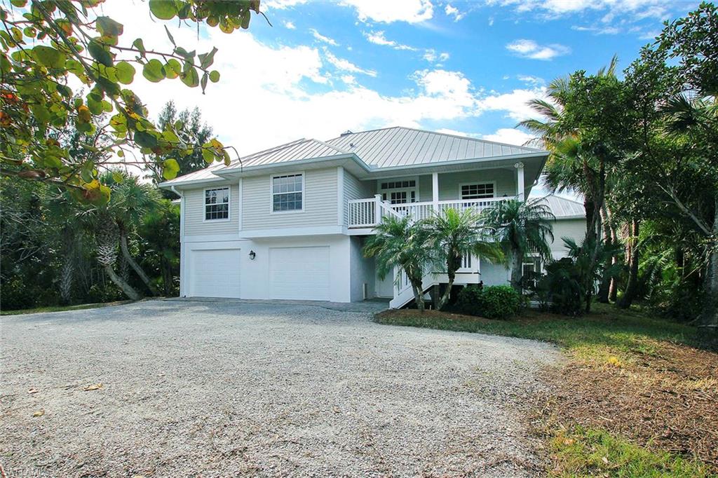 Outstanding home in sought after Butterknife Community. The primary part of the house features an open, tiled Living room / Dining Room with a granite countered kitchen. The large primary bedroom has an over-sized walk-in closet and french doors to the lanai overlooking the large heated pool. 2 additional bedrooms and bath are part of the main house. The private, separate guest suite is across the lanai and has an additional bedroom with morning kitchen and private bathroom. This property is private and convenient with an enclosed 2 car garage and boasts a great deal of additional storage. Deeded beach access to the left of Poinciana Condo driveway.