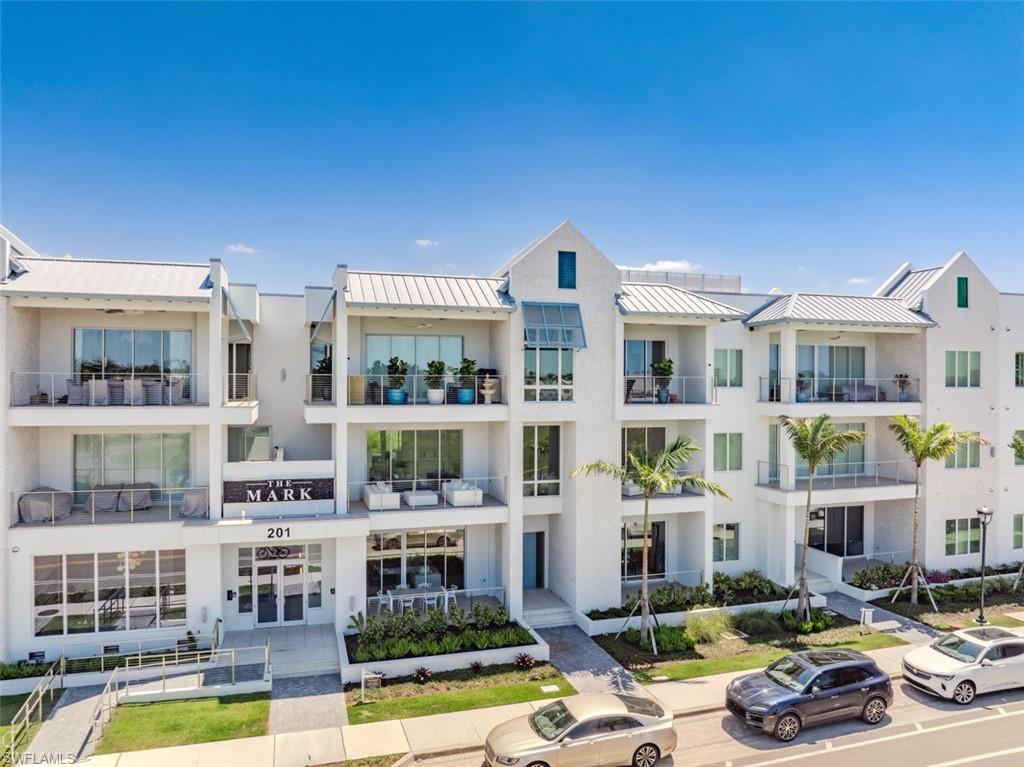 Welcome to The Mark on 8th, a premier luxury condominium development in downtown Naples. Ideally situated in the heart of Olde Naples, this residence is just steps away from the exceptional boutiques, cafes, restaurants, and pristine sandy beaches along the Gulf of Mexico. Residence 103 is a brand new impressive two-story townhome offering 3,449 square feet of luxurious living space, featuring 4 bedrooms, 4 full baths and 2 half baths, along with a second-floor loft lounge. Expansive 9-foot sliding doors lead to multiple private outdoor areas, seamlessly blending indoor and outdoor living. The gourmet kitchen, designed with both style and functionality in mind, overlooks the living and dining areas and is equipped with top-of-the-line appliances and exquisite finishes. The grand primary suite includes a private balcony, dual walk-in closets, and a serene spa-like bath for ultimate comfort. Additional highlights of this residence include two private storage units, a private elevator, and entrances on both levels for added convenience. The Mark on 8th offers a wealth of exceptional amenities, including an on-site golf simulator, a second-floor pool and spa, a fitness center, a sauna, and convenient attached parking. Enjoy outdoor grilling and unwind by the poolside fire pit, making this property a true oasis in the heart of Naples.