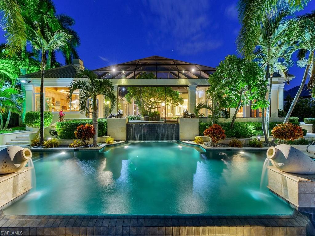 H.11923 Boaters Dream. Tastefully designed and privately gated this grand Port Royal residence is situated on an oversized lot and a quarter overlooking Runaway Bay.  Boasting over 6,600 elegant square feet, and offering wonderful entertaining spaces both inside and outside. The foyer, with elaborate onyx flooring, overlooks the 20-ft high formal living room with magnificent views of a  custom Koi Pond with waterfall and pool beyond. Open flowing floor plan offers a superb Master Suite, cherry wood office, exercise room, three ensuite guest quarters, separate sauna, gourmet Poggenpohl kitchen with extensive counter seating and separate breakfast nook all on one level. Beautiful outdoor spaces with heated infinity edge pool and spa, plus 123 feet of custom boat dock with its direct deep-water access to the Gulf of Mexico. Port Royal is one of the most exclusive area in the country. Located just moments from gourmet dining, luxury shopping boutiques and art galleries on Fifth Avenue & Third Street South. Membership is immediately available to the Port Royal Club, the only private beach club and restaurant in the City of Naples.