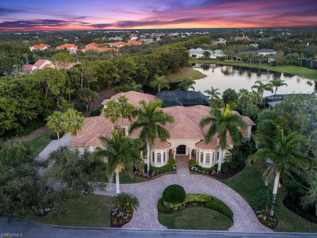 This custom home is the epitome of beauty and grace. Located on one of Grey Oaks most charming streets and in close proximity to the renowned amenities of Grey Oaks, this home is perfect for entertaining. Numerous sliding glass doors lead out to a spacious lanai and pool area allowing the interior living spaces to blend harmoniously with exterior spaces and the surrounding lush vegetation.  The great room concept, with additional living and dining rooms, features a chef's kitchen with a 6-burner Wolf cook-top, oversized Sub-Zero refrigerator, wall oven, convection oven, over-sized island, and large butler’s pantry.  This home lives like a sublime resort wrapped in lush landscaping with a private lake view.  The house even has it's own whole-house automated generator and a guest cabana with a private entrance off the covered lanai. This home is luxurious Grey Oaks living at its best! The house has been meticulously maintained and updated by the current owner. This home is a must see!