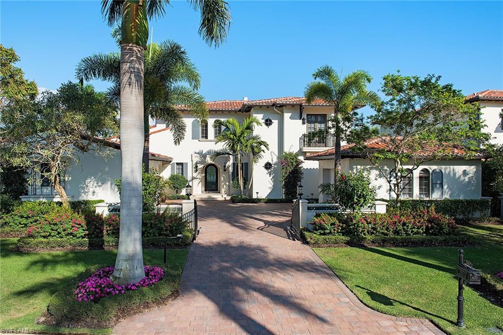 This custom home resides on a highly sought-after private lake and golf view homesite in the exclusive Mirada neighborhood of Estuary at Grey Oaks. Its nearly 6,000 square feet of living space is in immaculate condition and exudes quality throughout. The soft contemporary design includes four bedrooms, four full and two half baths, grand two-story foyer, dual studies and master closets. The entertaining possibilities are endless in this open floor plan including the gourmet kitchen with generous island and Wolf and Sub-Zero appliances. A formal dining space and family room with complete bar lead to an outdoor covered loggia with adobe gas fireplace, outdoor kitchen and motorized screens. The outdoor entertainment space also features a gas fire pit, a large infinity-edge pool and spa overlooking the incredibly private sparkling lake and golf course view. In addition, the home has a generator, climate-controlled three-and-a-half-car garage, Control 4 home automation and Andersen impact resistant windows and doors. Minutes from downtown Naples, world-class beaches, shopping and dining, Grey Oaks Country Club has recently undergone a nearly $40 million dollar renovation project.