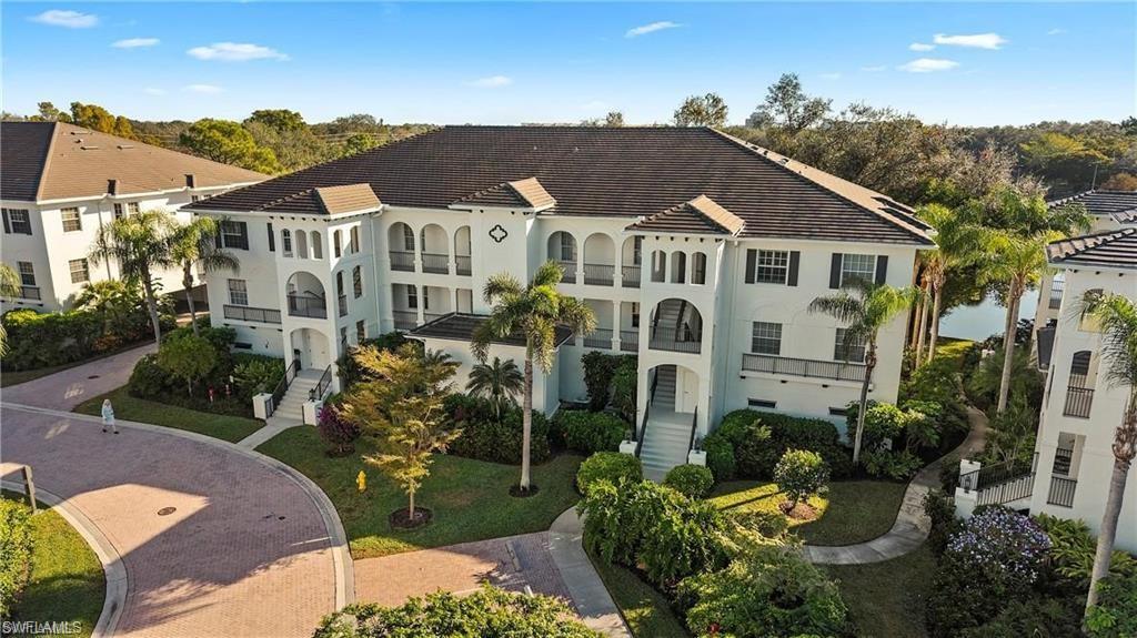 This 1,700+ sq. ft. coastal retreat offers the perfect blend of luxury, scale, and total peace of mind. Situated just a half-mile from the turquoise waters of the Gulf of America, the residence has tropical and private lake views. Also has the rare convenience of a two-car private garage located securely under the building with elevator access. The complex has recently undergone extensive modern upgrades, including new roofs in 2022, fresh exterior paint in 2023, and a complete building re-pipe with new plumbing in 2024, ensuring a truly turnkey experience for the next owner. Inside, the spacious floor plan flows effortlessly to a screened lanai equipped with electric shutters for effortless storm protection and privacy. The location is second to none, situated within easy walking distance of the brand-new Pelican Bay Tennis and Pickleball facility that just opened its doors in December 2025. As a resident of Pelican Bay, you will enjoy an unrivaled resort lifestyle that includes private beach access via scenic tram service through lush preserves, two exclusive oceanfront restaurants, and full beach services including chairs, umbrellas, and kayaks. The community further enhances the active lifestyle with a 27-hole golf course, three state-of-the-art fitness centers, comprehensive wellness programs, and miles of shaded walking and biking trails. Perfectly positioned for the culturally minded, this home provides immediate access to Artis—Naples, as well as the world-class shopping and dining at Waterside Shops and Mercato. Experience the gold standard of Naples living in a building that has been fully modernized for the future. Sink will be replaced.
