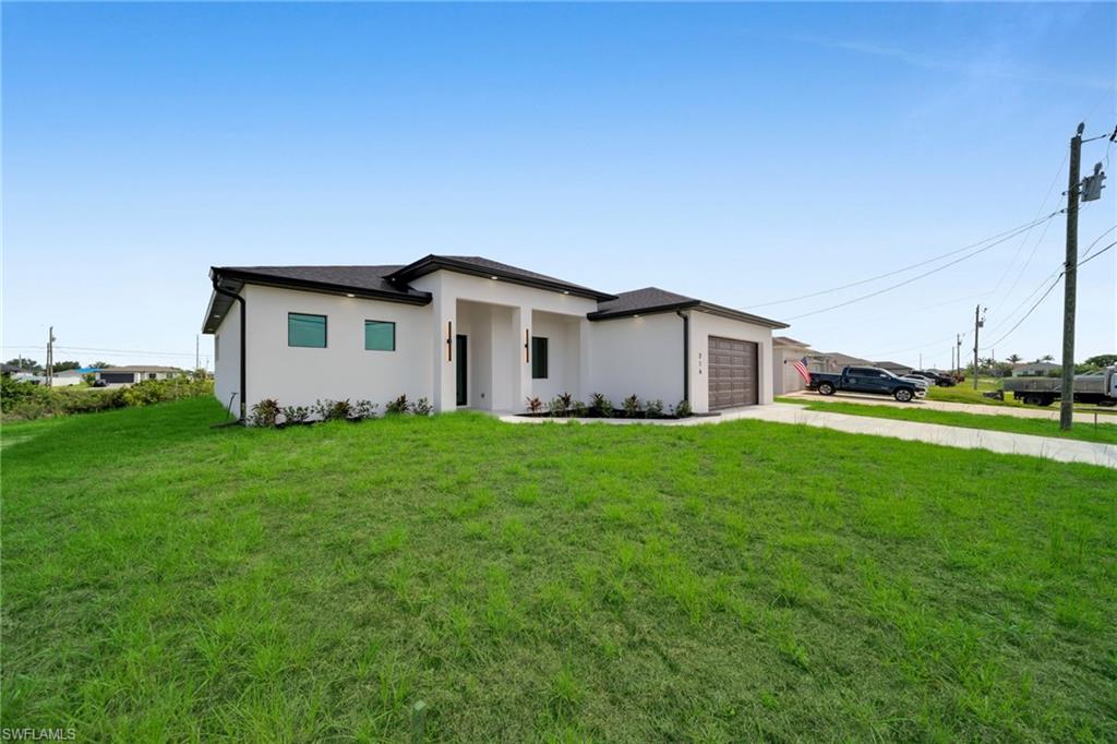 Experience the best of SOUTHWEST FLORIDA living in this stunning NEW CONSTRUCTION WATERFRONT HOME perfectly situated on a peaceful freshwater CANAL in one of CAPE CORAL'S fastest-growing neighborhoods. Combining modern architecture, high-end finishes, and a functional design, this exceptional residence offers 3 BEDROOMS + DEN, 2 BATHROOMS and is ready for you to move in and start enjoying the Florida lifestyle. 

Best of all, enjoy the freedom of homeownership with NO HOA and NO CDD FEES. Step inside and be welcomed by soaring tray ceilings, oversized PORCELAIN TILE FLOORING THROUGHOUT, abundant natural light, and an open-concept floor plan designed for comfortable everyday living and effortless entertaining.

At the heart of the home is the chef-inspired kitchen, featuring sleek European-style soft-close cabinetry, elegant QUARTZ COUNTERTOPS, a large ISLAND, SAMSUNG STAINLESS STEEL APPLIANCES, PENDANT LIGHTING, and generous storage space.

The spacious OWNER'S SUITE is a private retreat OVERLOOKING THE CANAL, complete with DIRECT LANAI ACCESS, a spa-inspired bathroom featuring DUAL QUARTZ VANITIES, an LED BACKLIT MIRROR, a SMART BIDET TOILET, a WALK-IN SHOWER with rainfall showerhead, handheld sprayer, stunning accent tile wall, matte black fixtures, and a large WALK-IN CLOSET.

The versatile DEN provides the perfect space for a HOME OFFICE, MEDIA ROOM, or GUEST ROOM, while the guest bedrooms are generously sized with ample closet space. Every detail has been carefully selected, from the contemporary interior doors and black hardware to the premium finishes found throughout the home.

The Florida lifestyle truly comes alive outdoors. Relax on the expansive COVERED LANAI featuring DUAL CEILING FANS and a fully equipped OUTDOOR KITCHEN with sink and prep area—perfect for entertaining family and friends. Enjoy peaceful CANAL VIEWS, beautiful FLORIDA SUNSETS, and plenty of room to DESIGN YOUR DREAM POOL and BACKYARD OASIS.

Additional features include IMPACT-RESISTANT WINDOWS AND DOORS, a spacious LAUNDRY ROOM with utility sink and custom cabinetry, EPOXY-COATED GARAGE FLOOR, modern landscaping, and exceptional craftsmanship throughout.

Located just minutes from shopping, dining, golf courses, parks, boat ramps, and Cape Coral's growing entertainment options, you'll also enjoy convenient access to some of SOUTHWEST FLORIDA'S WORLD-FAMOUS BEACHES, fishing, boating, and outdoor recreation.

Whether you're searching for your PRIMARY RESIDENCE, a SEASONAL GETAWAY, or an INVESTMENT OPPORTUNITY, this exceptional WATERFRONT HOME offers luxury, comfort, and the Florida lifestyle you've been dreaming of. Schedule your private showing today!
