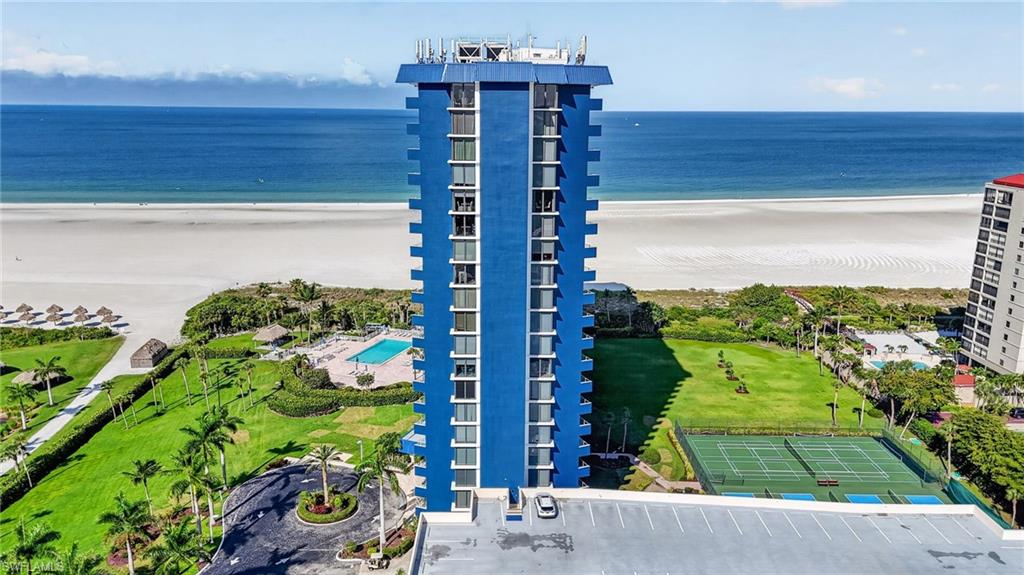 This beautiful beachfront condominium has the proverbial million dollar view. Every room of this south facing residence looks across the 12 acre park at the Resident’s Beach with 1500 feet of forever to be undeveloped beachfront. 

This very rare location has panoramic views all the way down Marco Island’s famous crescent shaped beach. The contrast of the lush green park, the snow white sand, blue-green water, and azure sky paint a palate that stimulates the senses.

This condominium and the entire building and development has just undergone a remarkable transformation as everything is brand new. 

The residence is completely remodeled and appointed with all new furnishings. Painted bright white throughout the first thing you notice is the magnificent 3’x3’ large format satin finish imported porcelain tile throughout. Beautiful veins of soft grey weave through the tile giving subtle wave like motion. The look is reminiscent of Carrera marble with the hardness, durability, and easy care of porcelain tile.

The kitchen and baths have been curated and finished with high end modern fixtures, cabinetry, appliances, and more exquisite tile work. 

Call today for more information about this fantastic new offering.